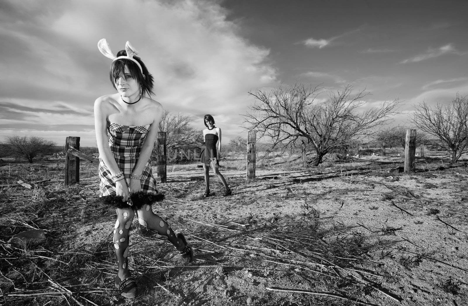 Two punk girls posing in a rural setting