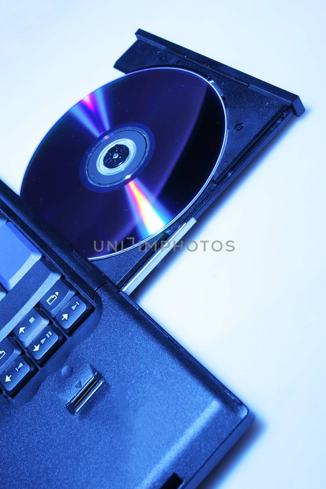 brand new laptop with cd in open cd drive, shot on white