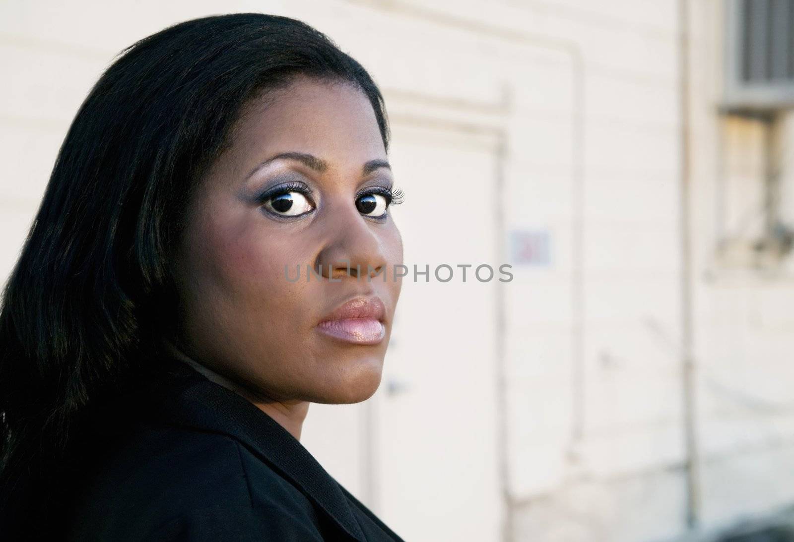 African American Business Woman by Industrial Building by Creatista