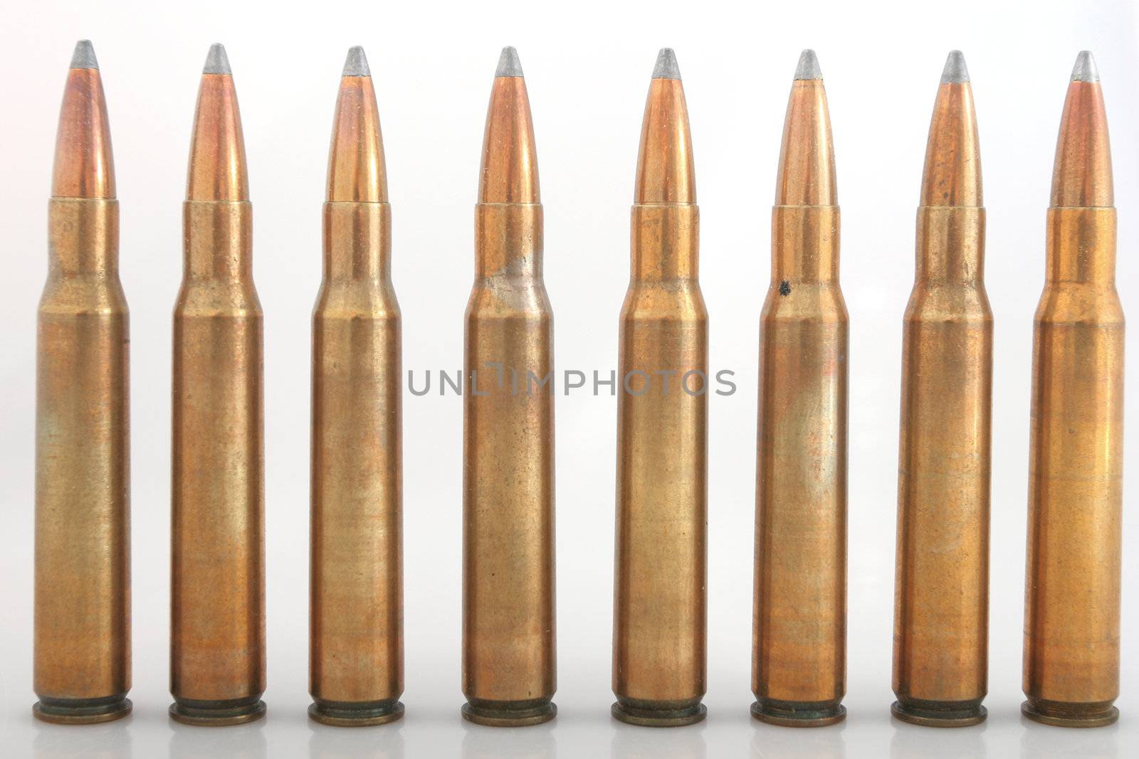 Rifle bullets in a row, big caliber 30-06, isolated on white