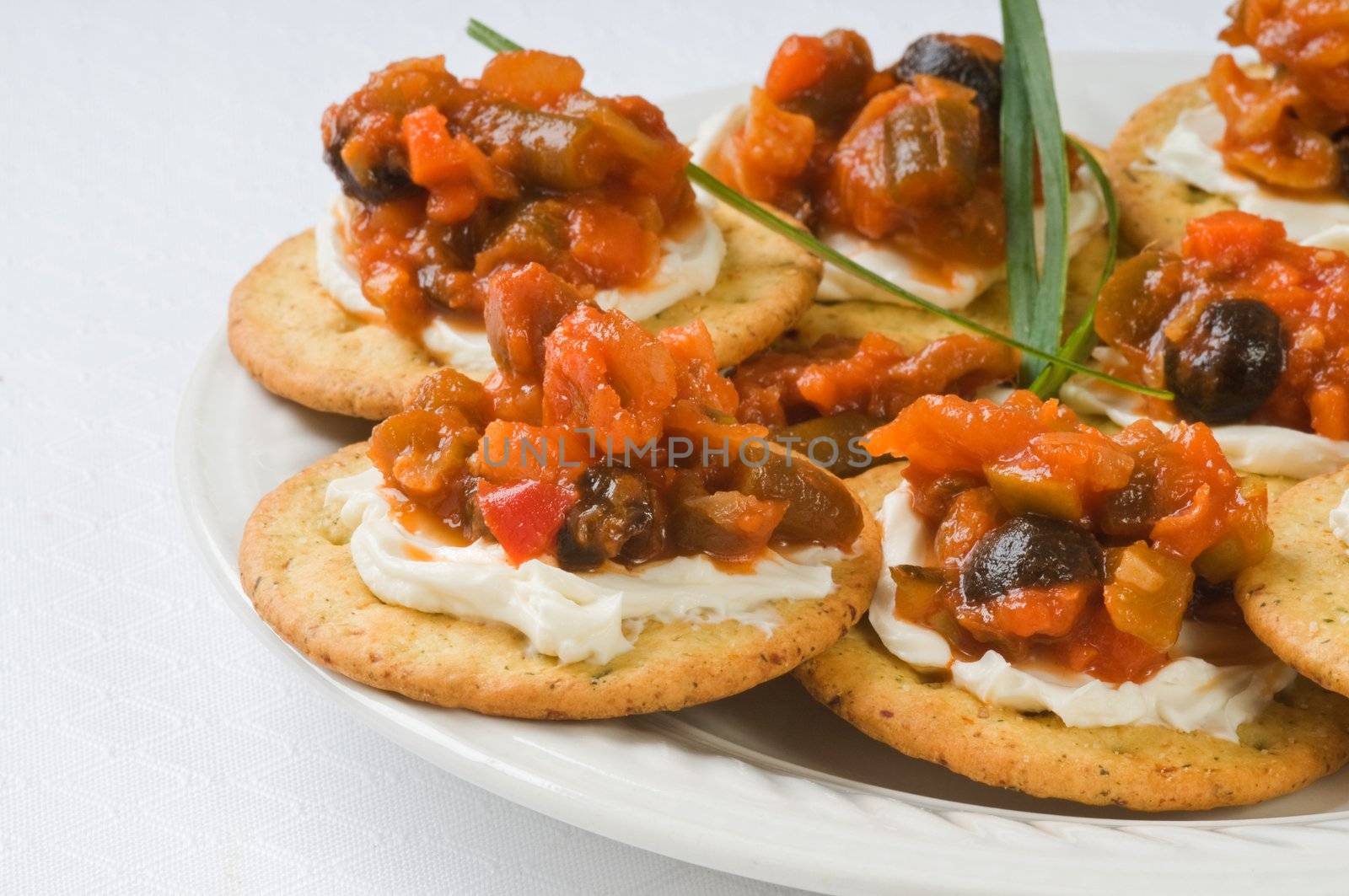 Delicious appetizers made with cream cheese and antipasto.
