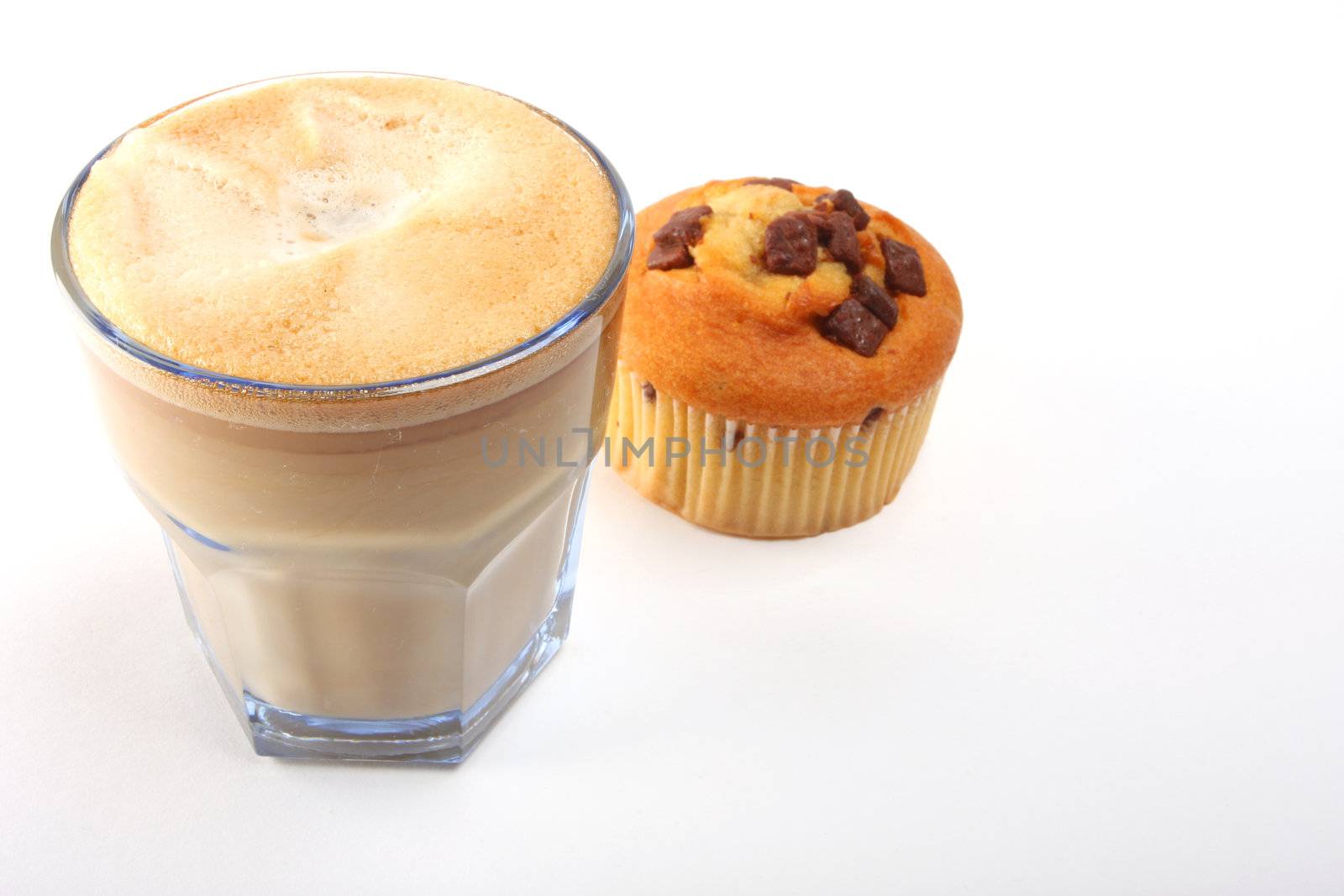 A shot of a a cup of coffee with muffins 