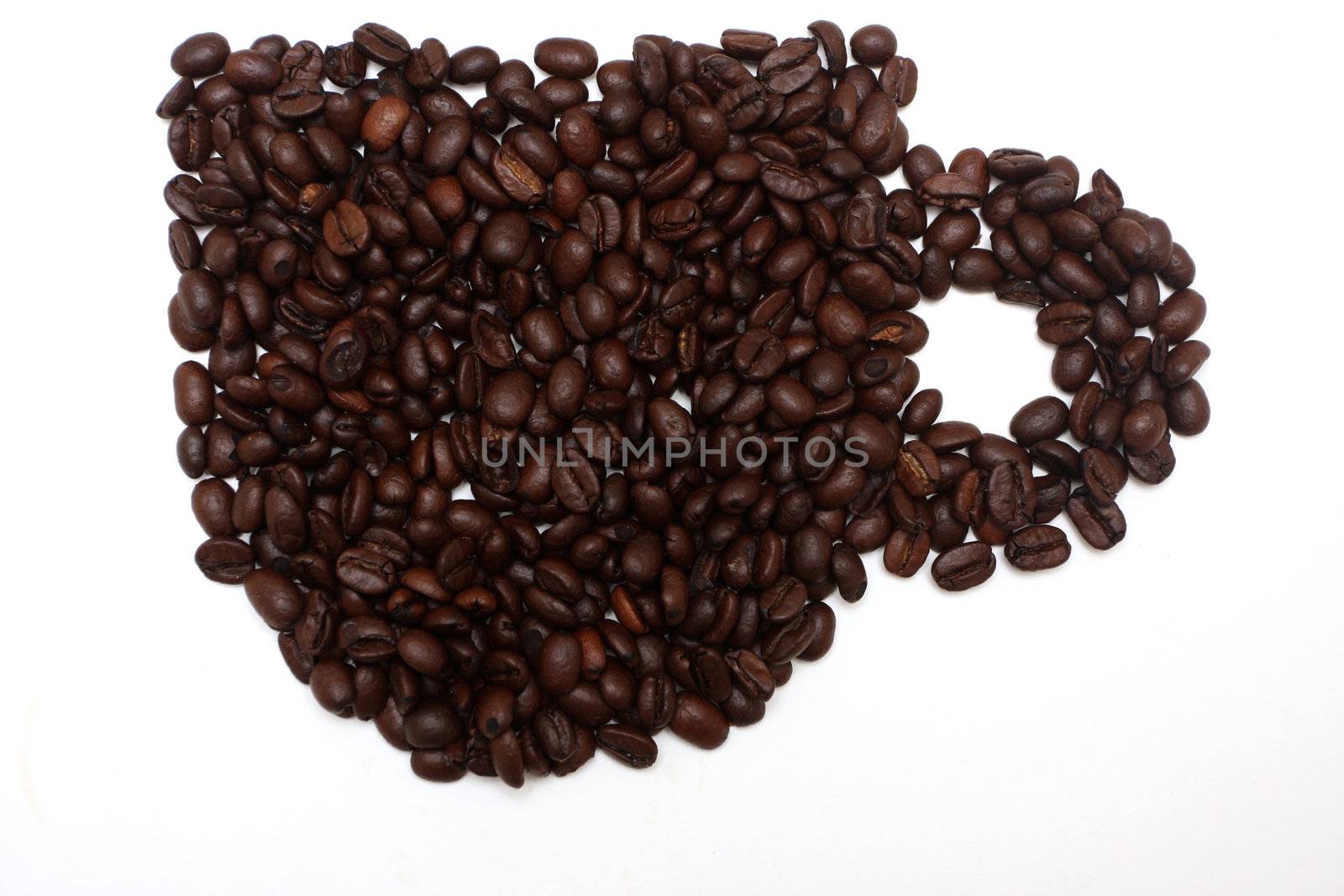 coffeebeans arranged in the shape of a cup, isolated on white