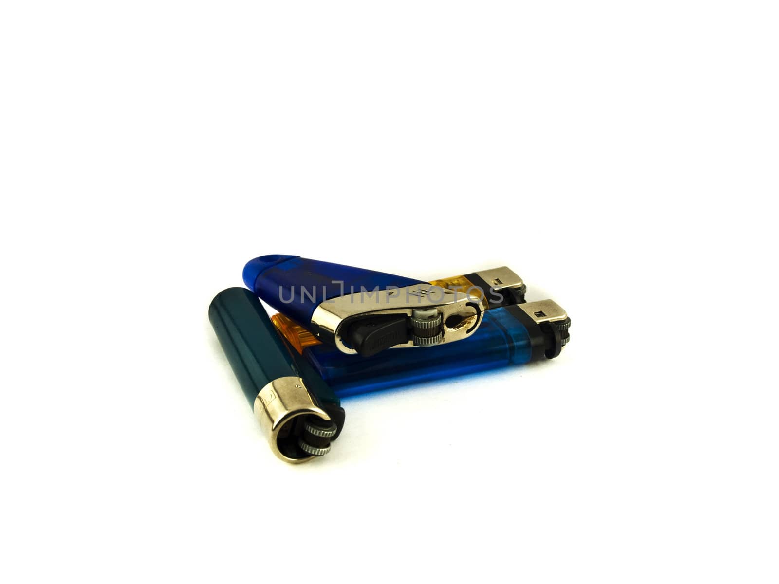 Disposable Lighters on White Background by bobbigmac