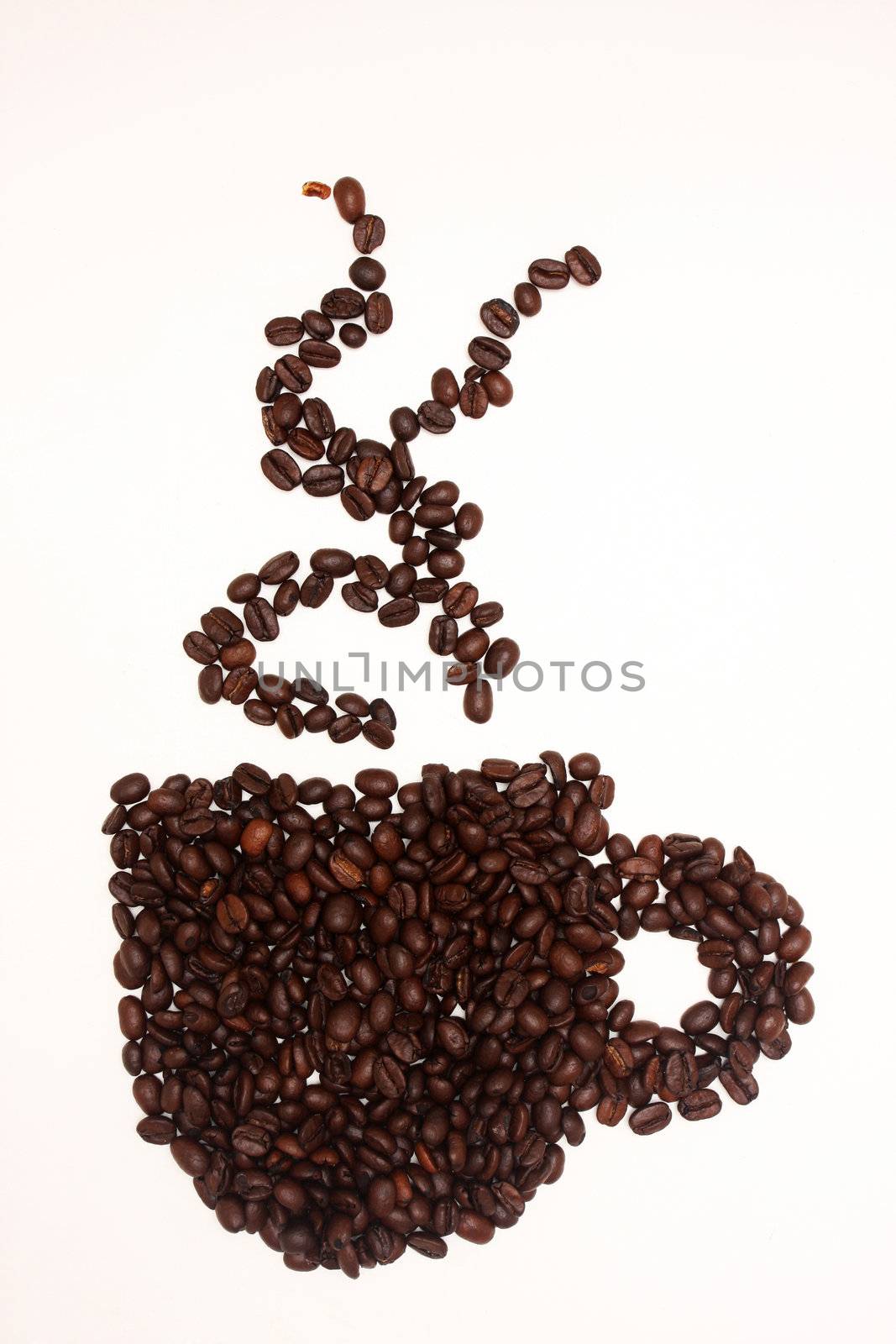 coffeebeans arranged in the shape of a cup, isolated on white