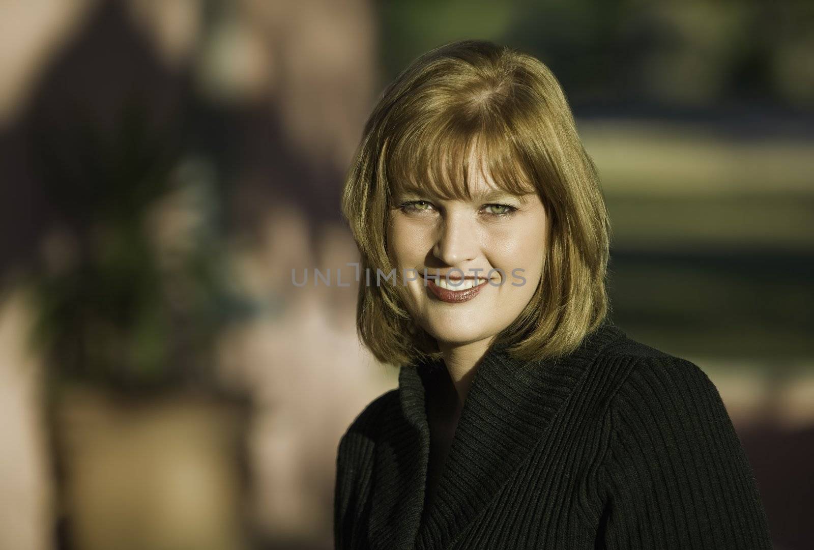 Blonde smiling woman model with green eyes 