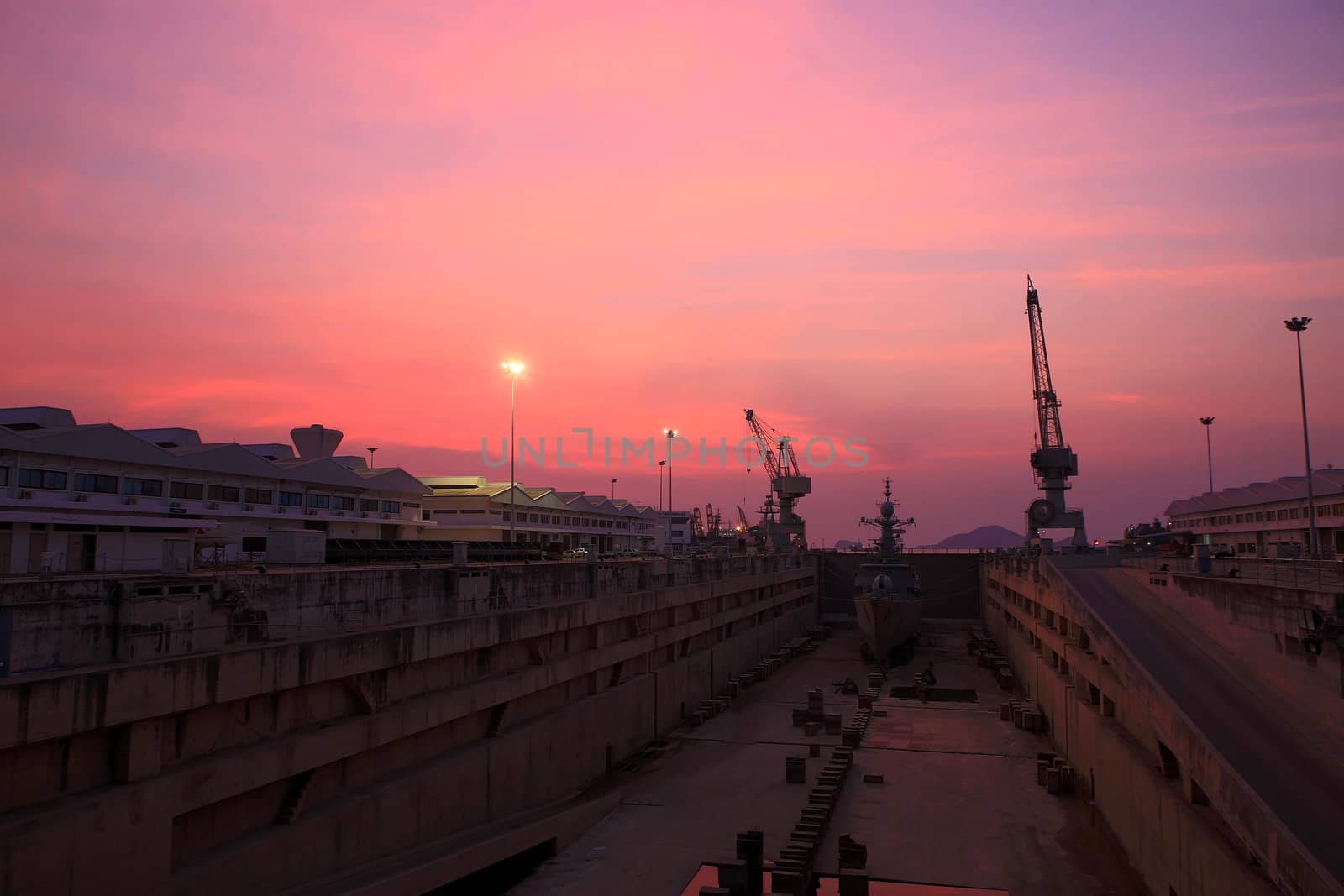 HRD:Crane near a covered dry dock at the shipyard by rufous