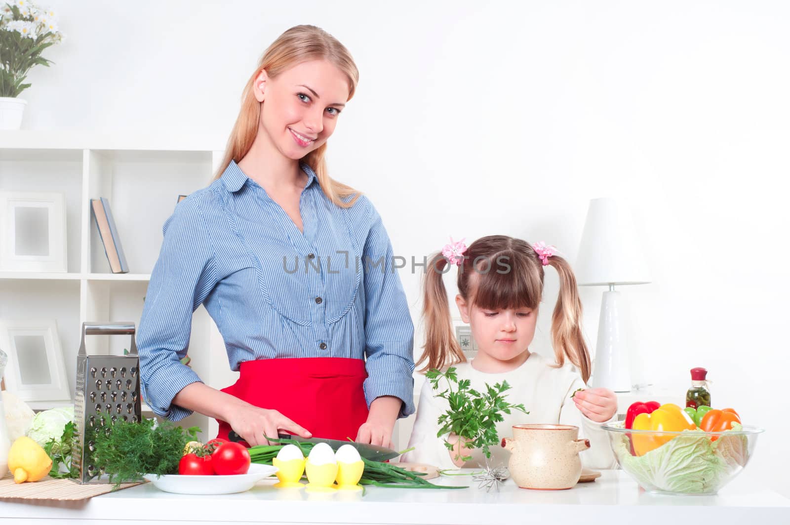 Mother and daughter cooking together, help children to parents