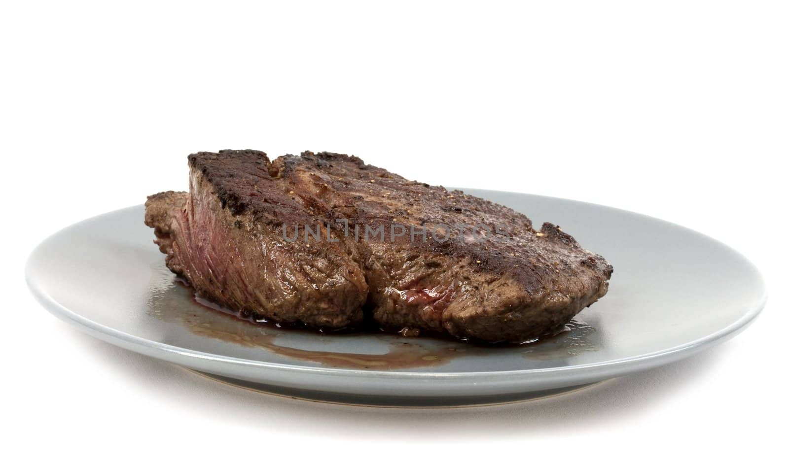 Bloody red rare entrecote isolated on white