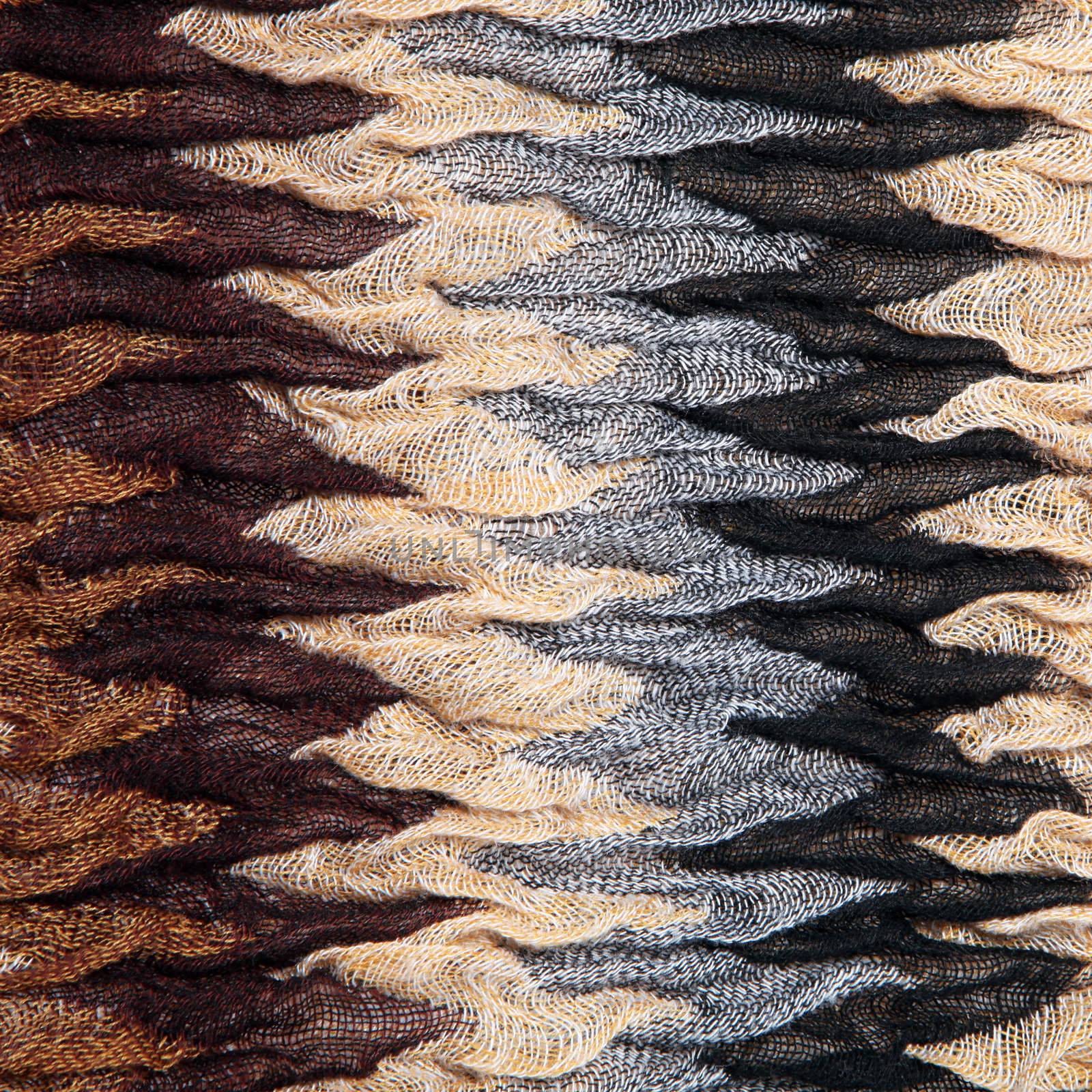 Soft luxurious ruched fabric with a knit texture and distinctive zig-zag striped pattern in shades of brown and grey