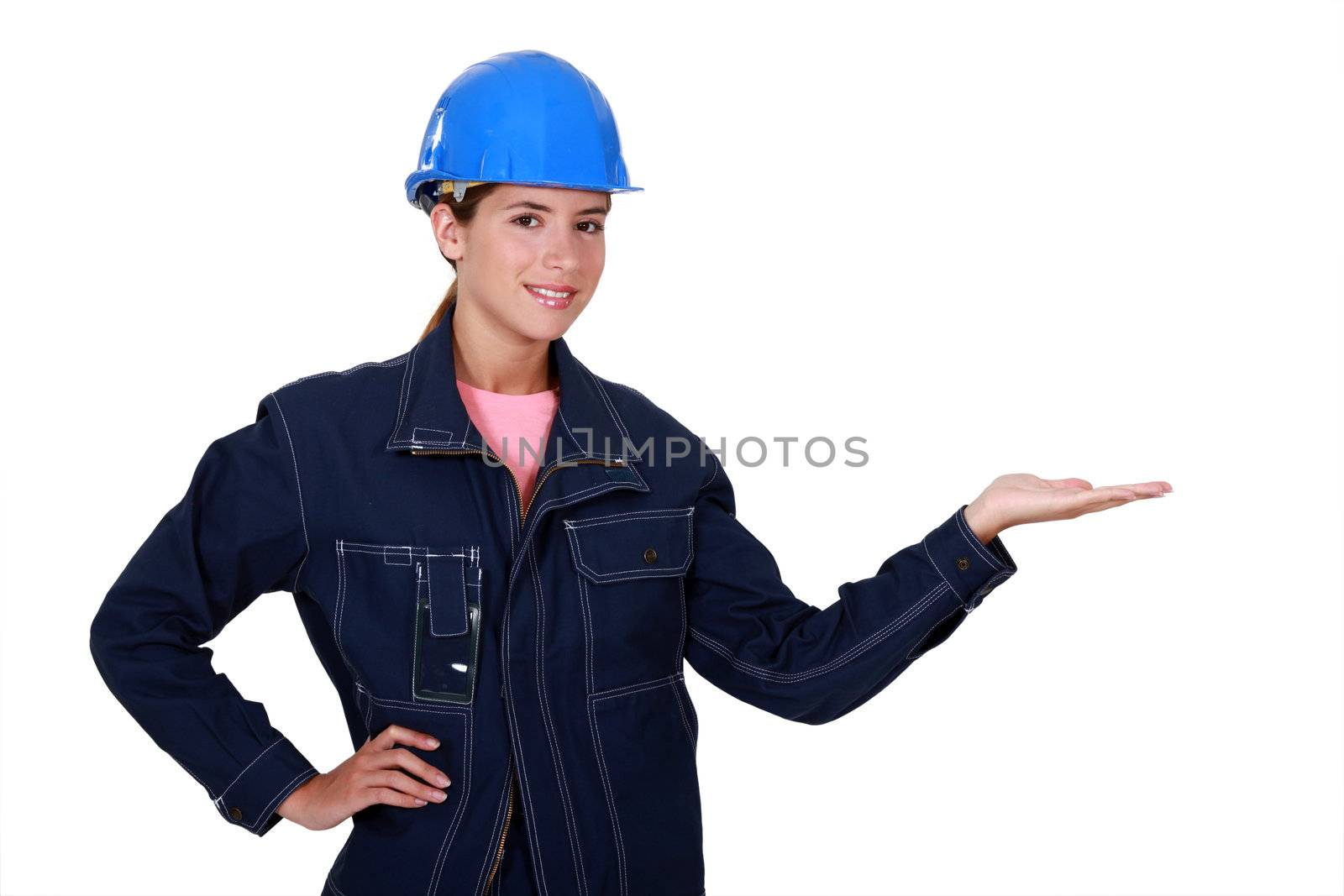 Manual worker holding out her hand in empty copyspace by phovoir