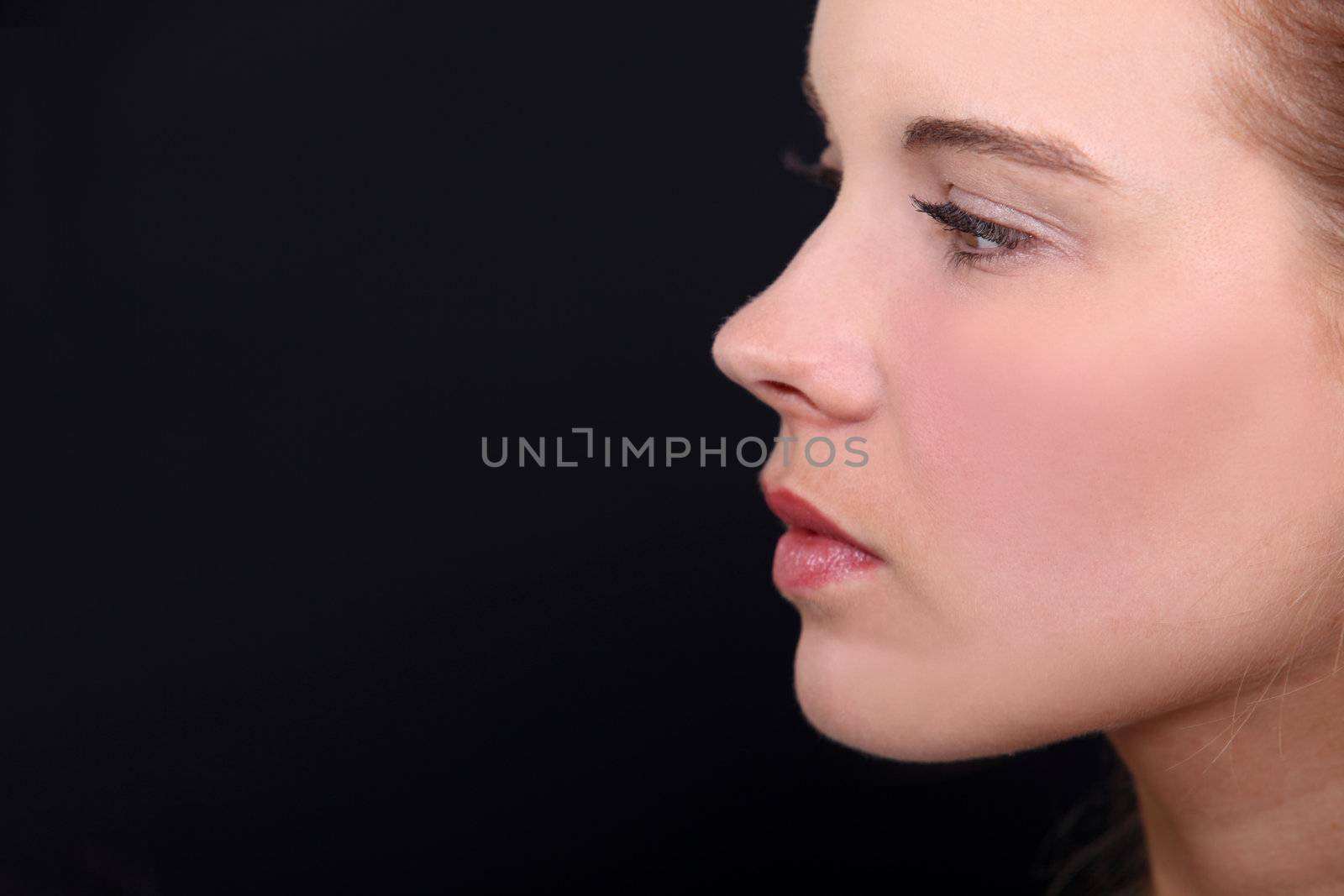 Head-shot of woman in studio by phovoir