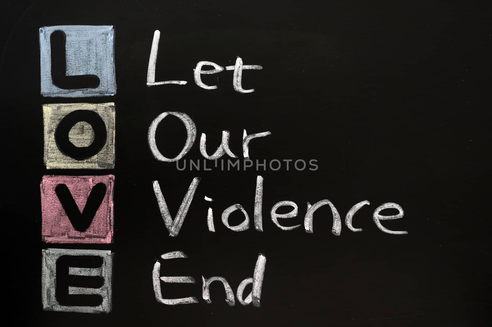 LOVE acronym, Let our violence end on a blackboard with words written in chalk