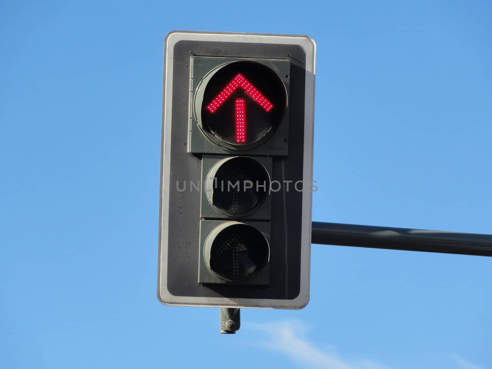 Photo of a traffic sign with a red arrow displayed