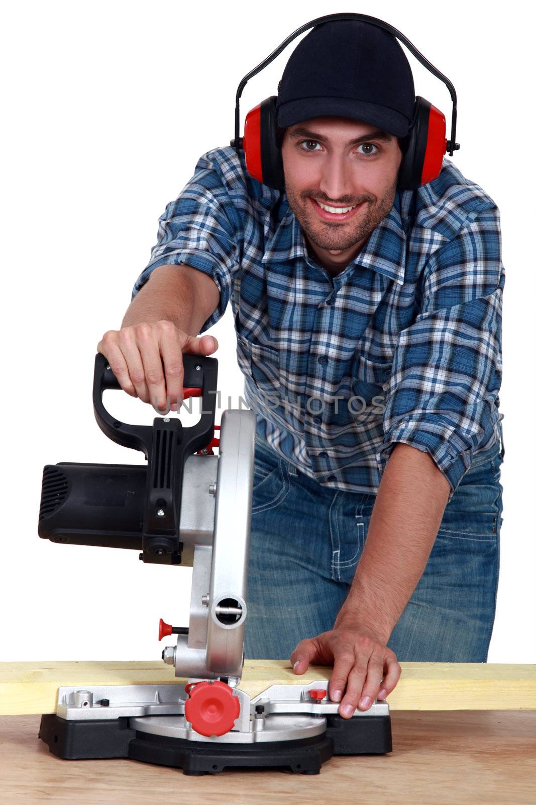 A carpenter with a circular saw.