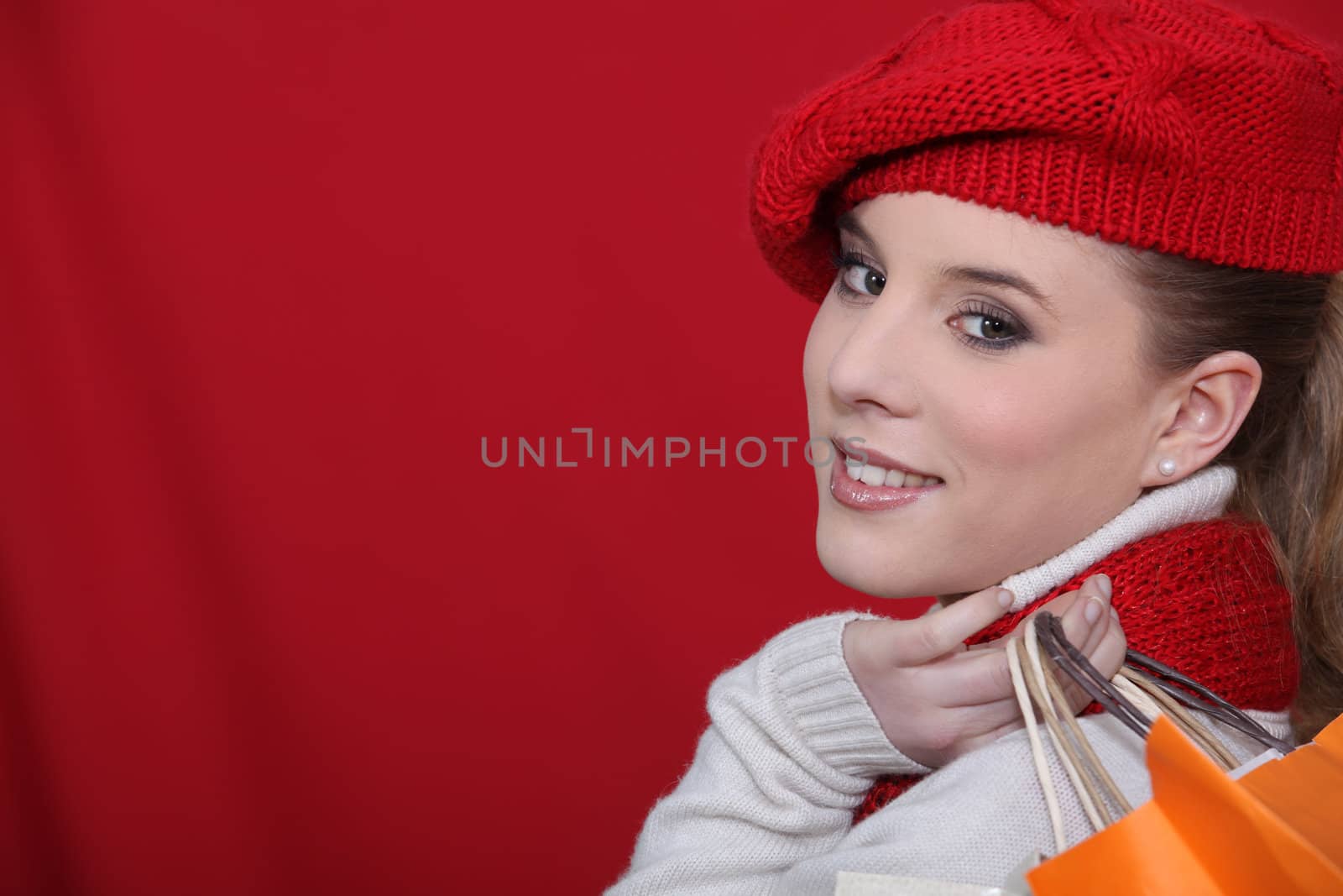 Woman holding shopping bags by phovoir