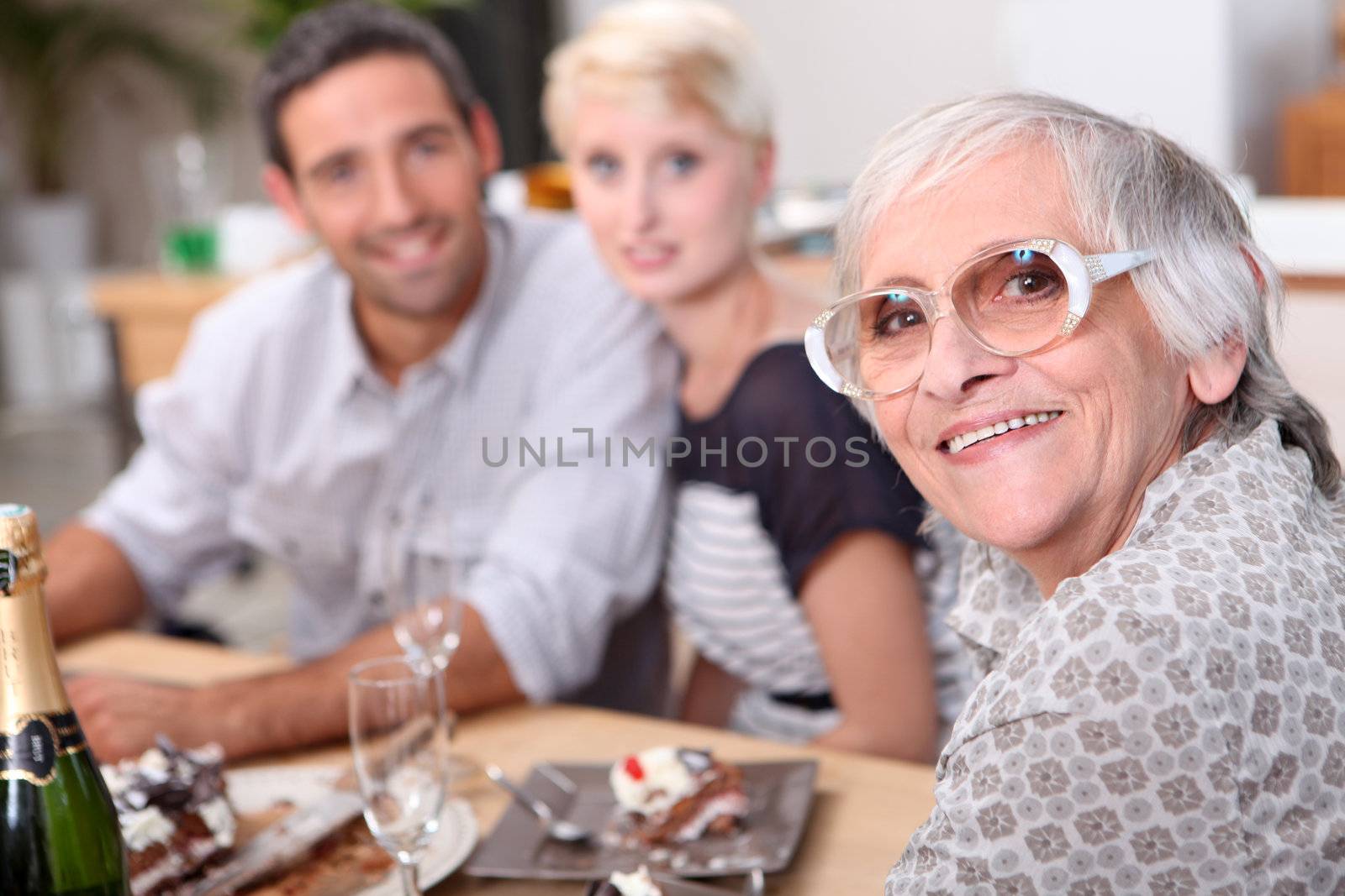 family having dinner by phovoir