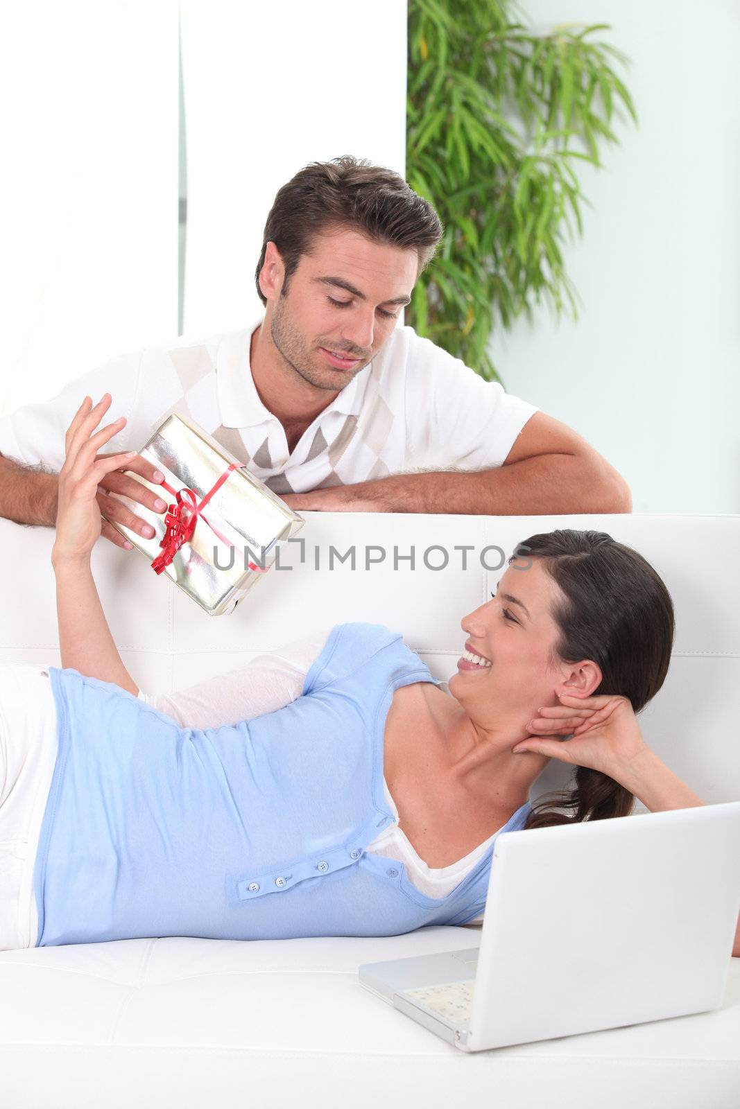 Boyfriend offering gift to girl by phovoir