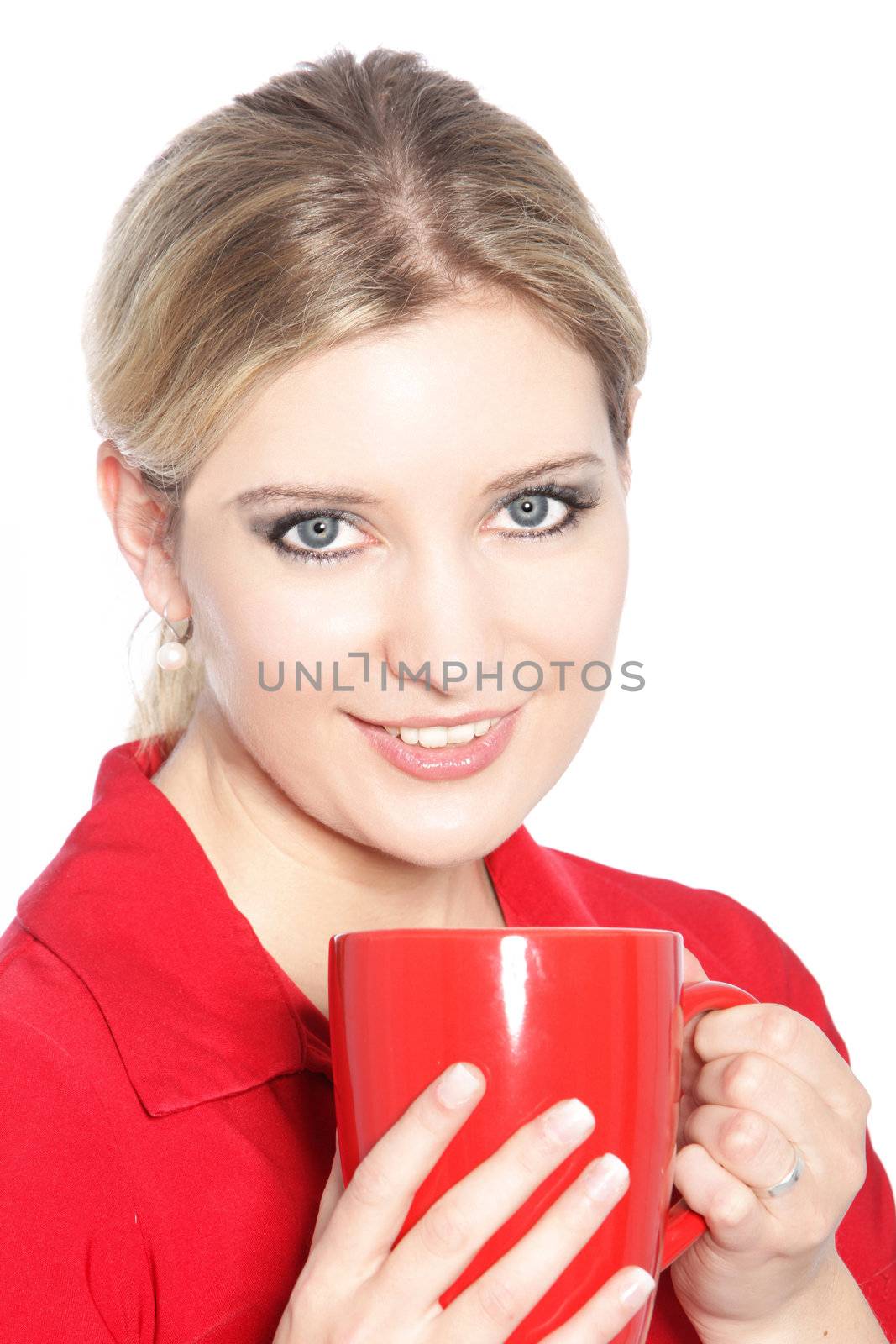 Portrait of a beautiful blonde woman holding a cup of coffee