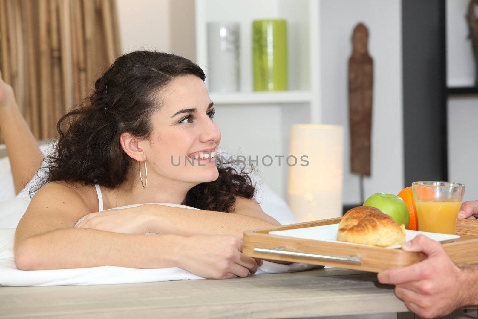 Man bringing breakfast to girlfriend by phovoir