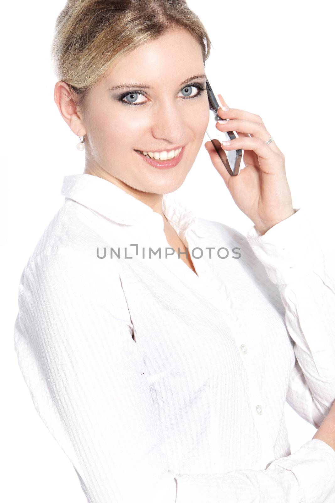 Smiling businesswoman calling using her cellular phone