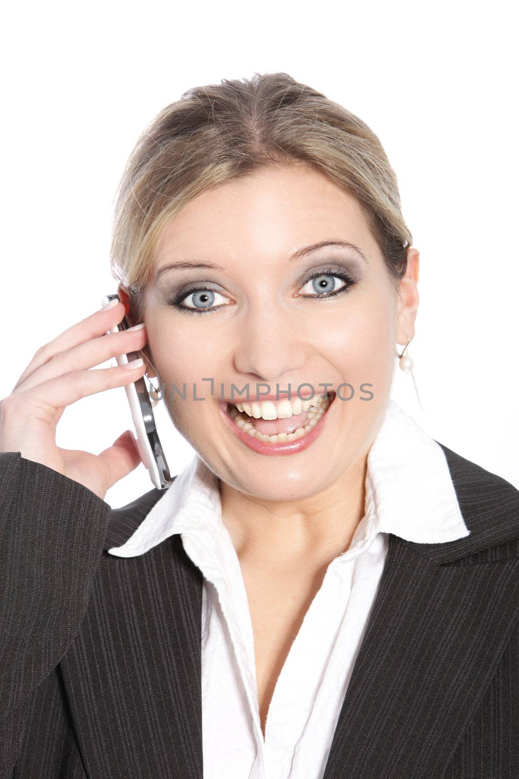 Excited businesswoman calling through her cell phone