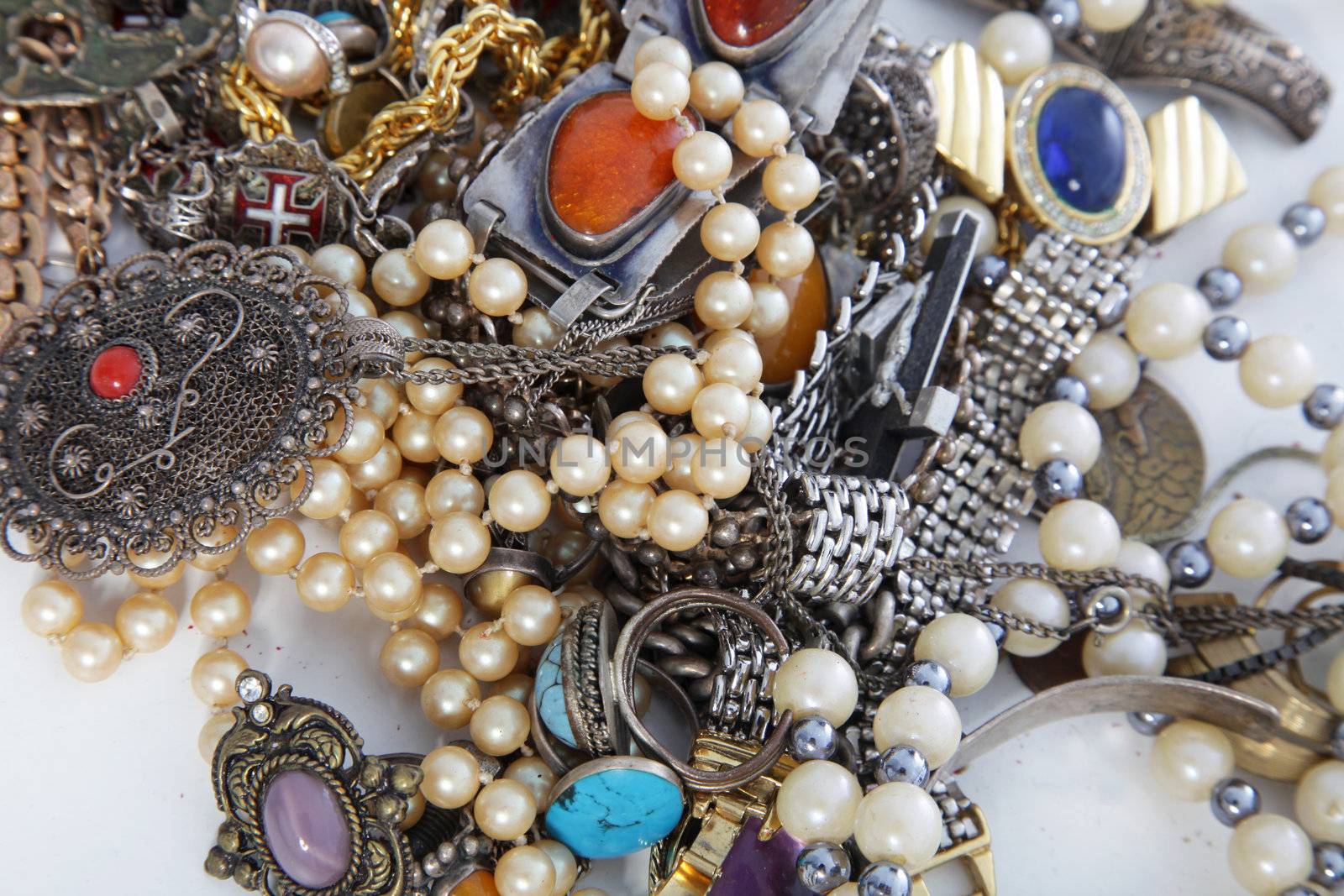 Assorted pile of gemstone, silver and pearl jewellery with necklaces, bracelets, pendants and rings