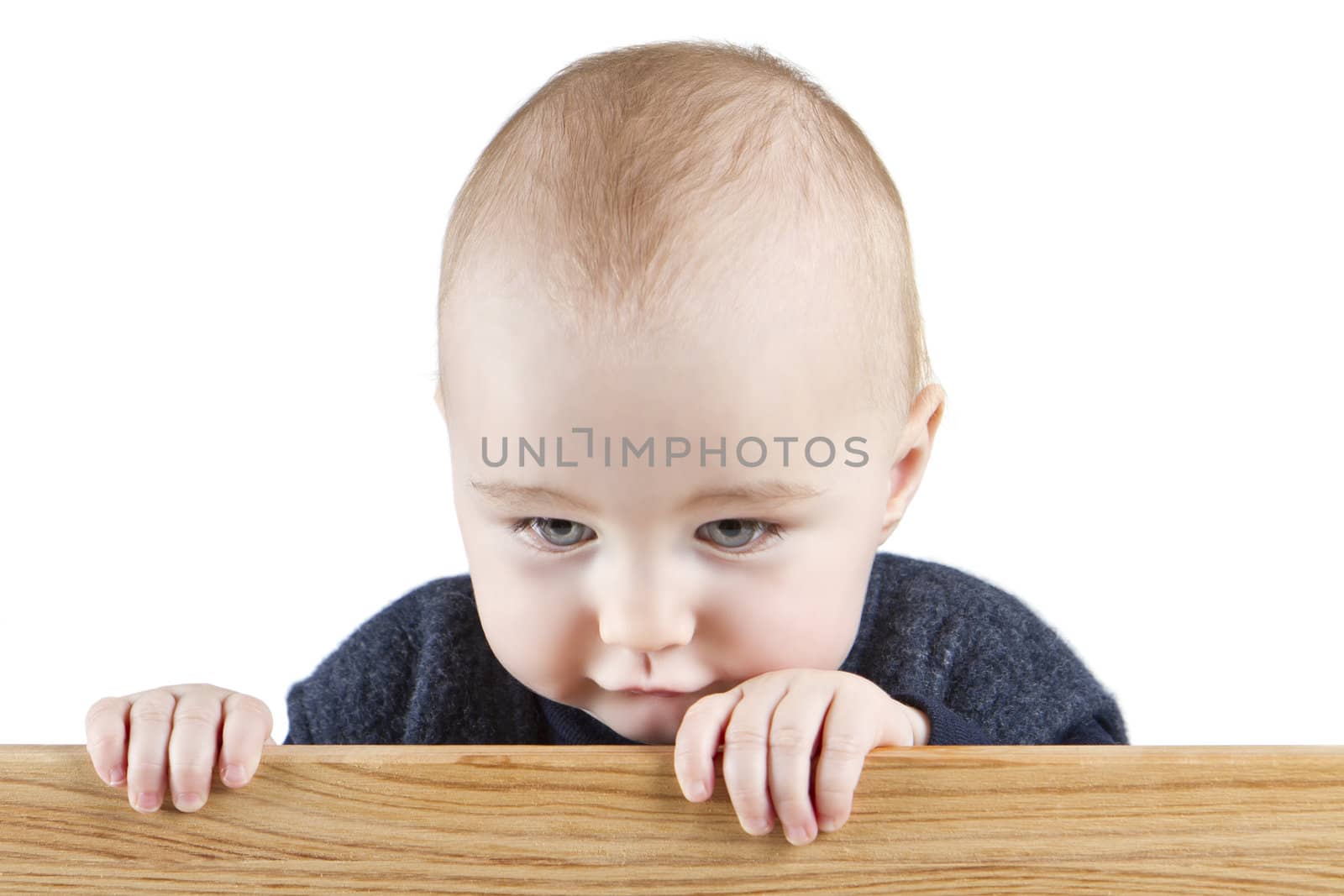 young child holding wooden board. isolate on white background