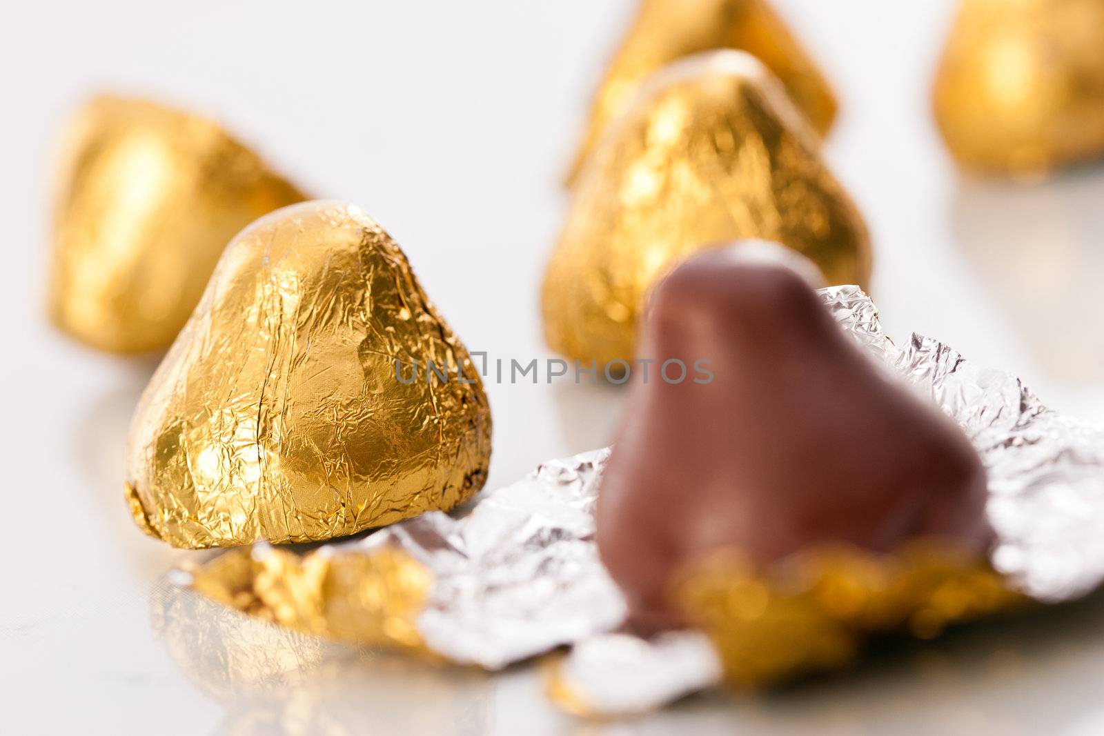 sweet, chocolate candy on the golden foil