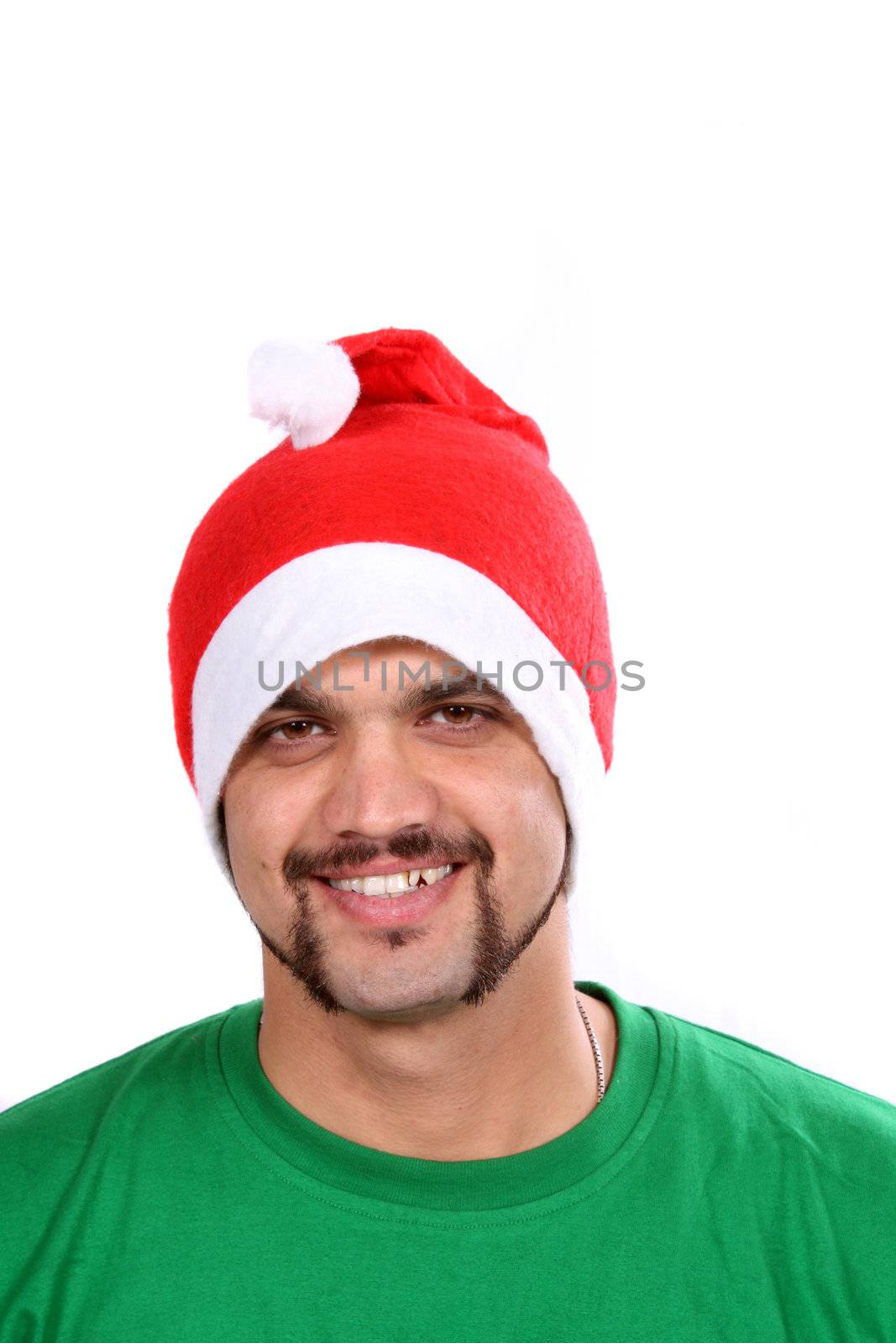 A young Indian guy wearing a santa hat during Christmas in India, on white studio background.