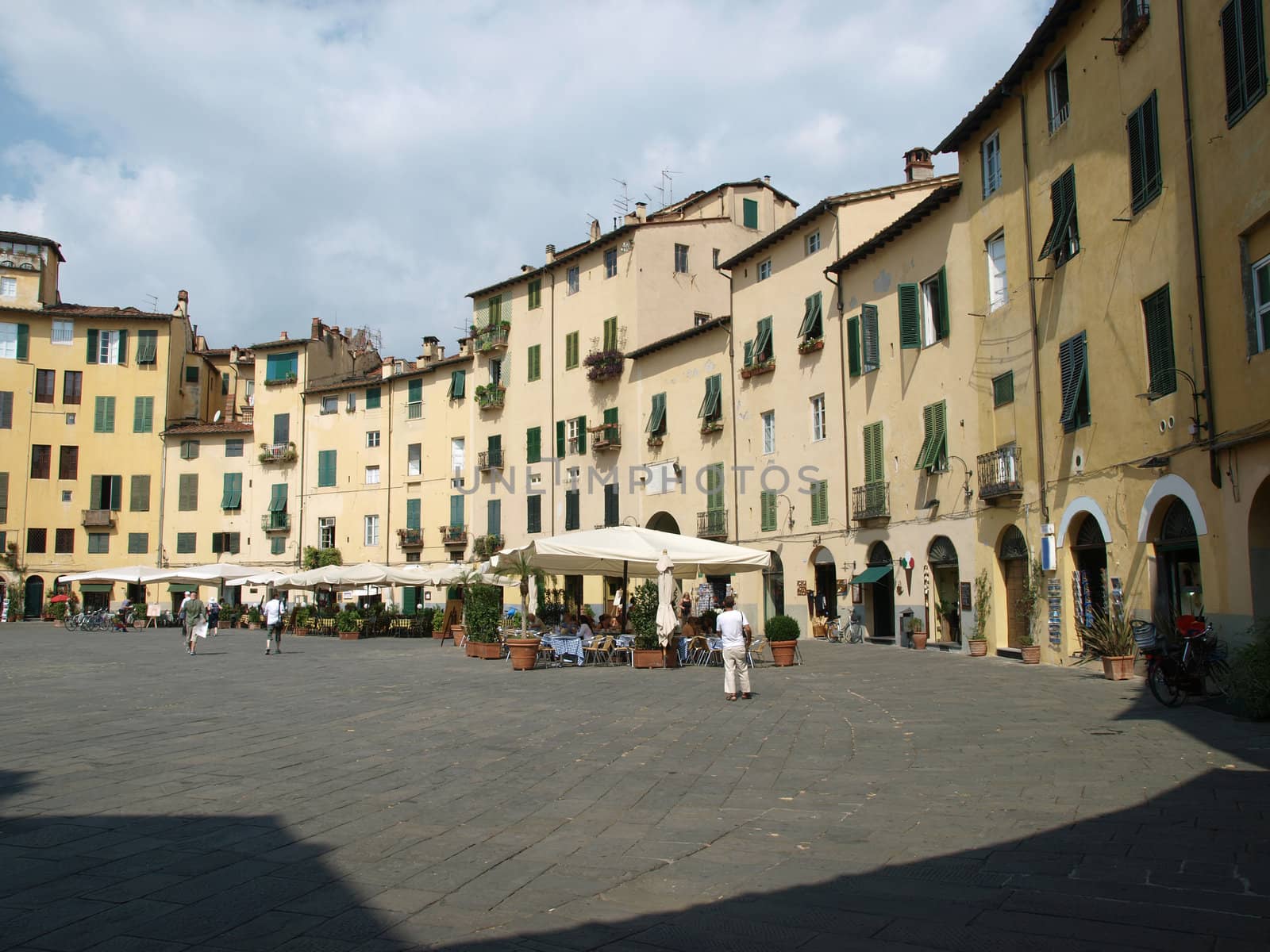 The Piazza Anfiteatro - Lucca , Italy. View from piazza Anfiteatro, former a Roman Ampitheatre, in Lucca. Tuscany, Italy.