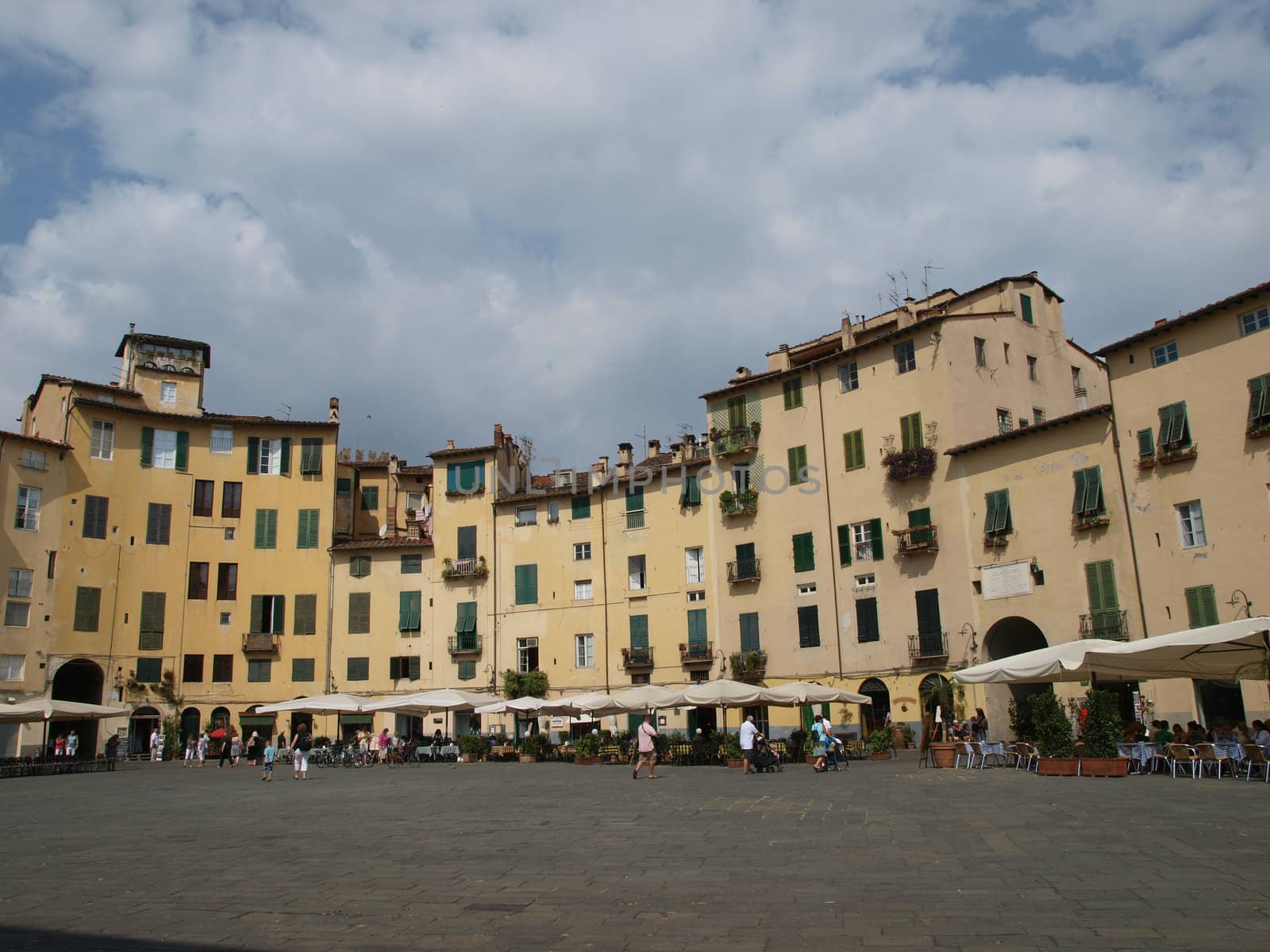 The Piazza Anfiteatro - Lucca , Italy. View from piazza Anfiteatro, former a Roman Ampitheatre, in Lucca. Tuscany, Italy.