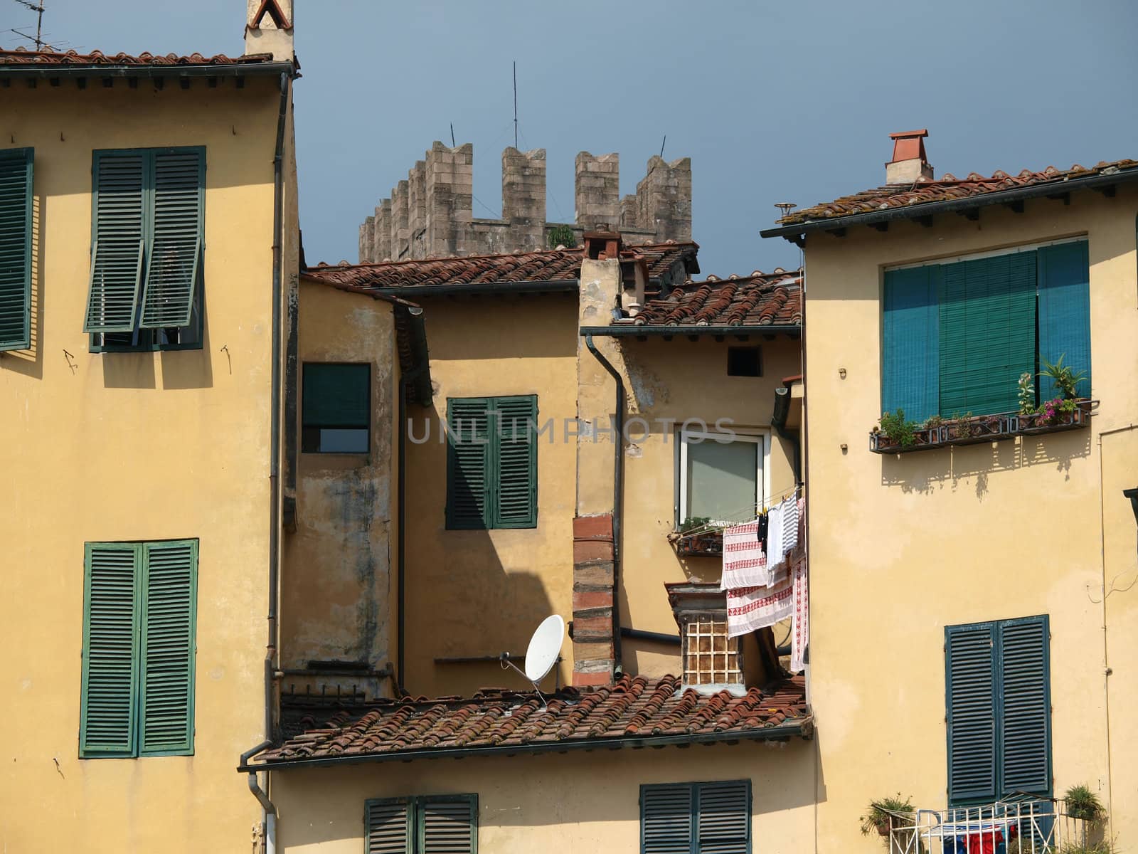 The Piazza Anfiteatro - Lucca , Italy. View from piazza Anfiteatro, former a Roman Ampitheatre, in Lucca. Tuscany, Italy.
