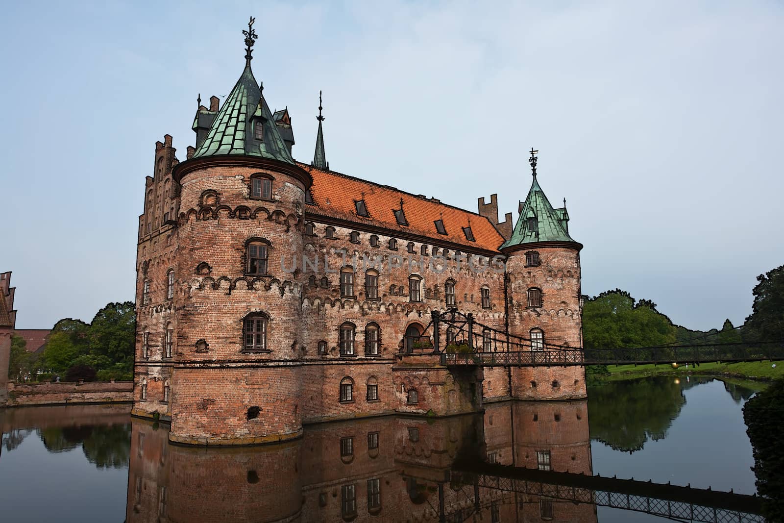 Egeskov castle slot landmark fairy tale castle in Funen Denmark Medieval symbol digital art manipulated