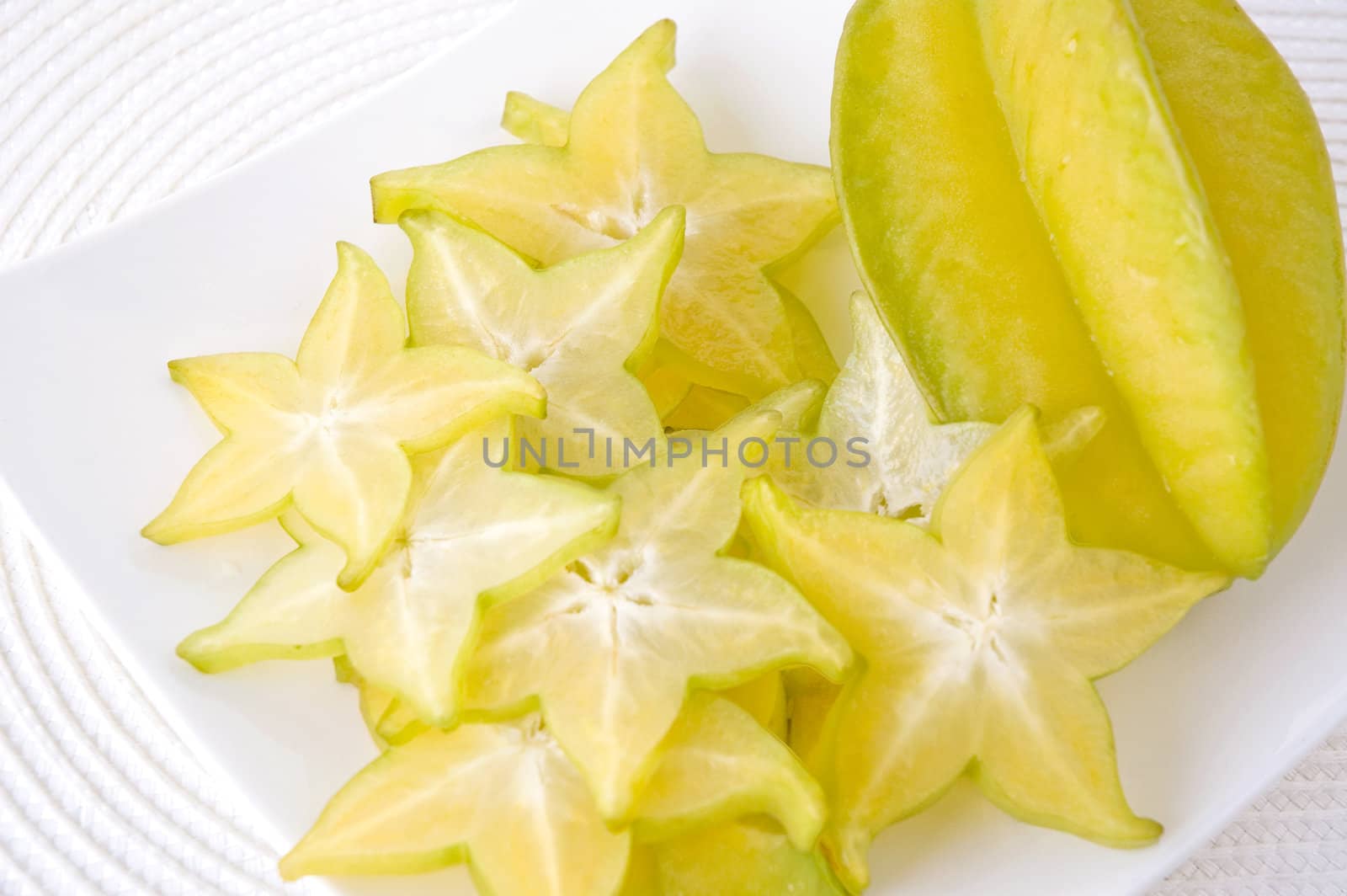 sliced carambola on white plate