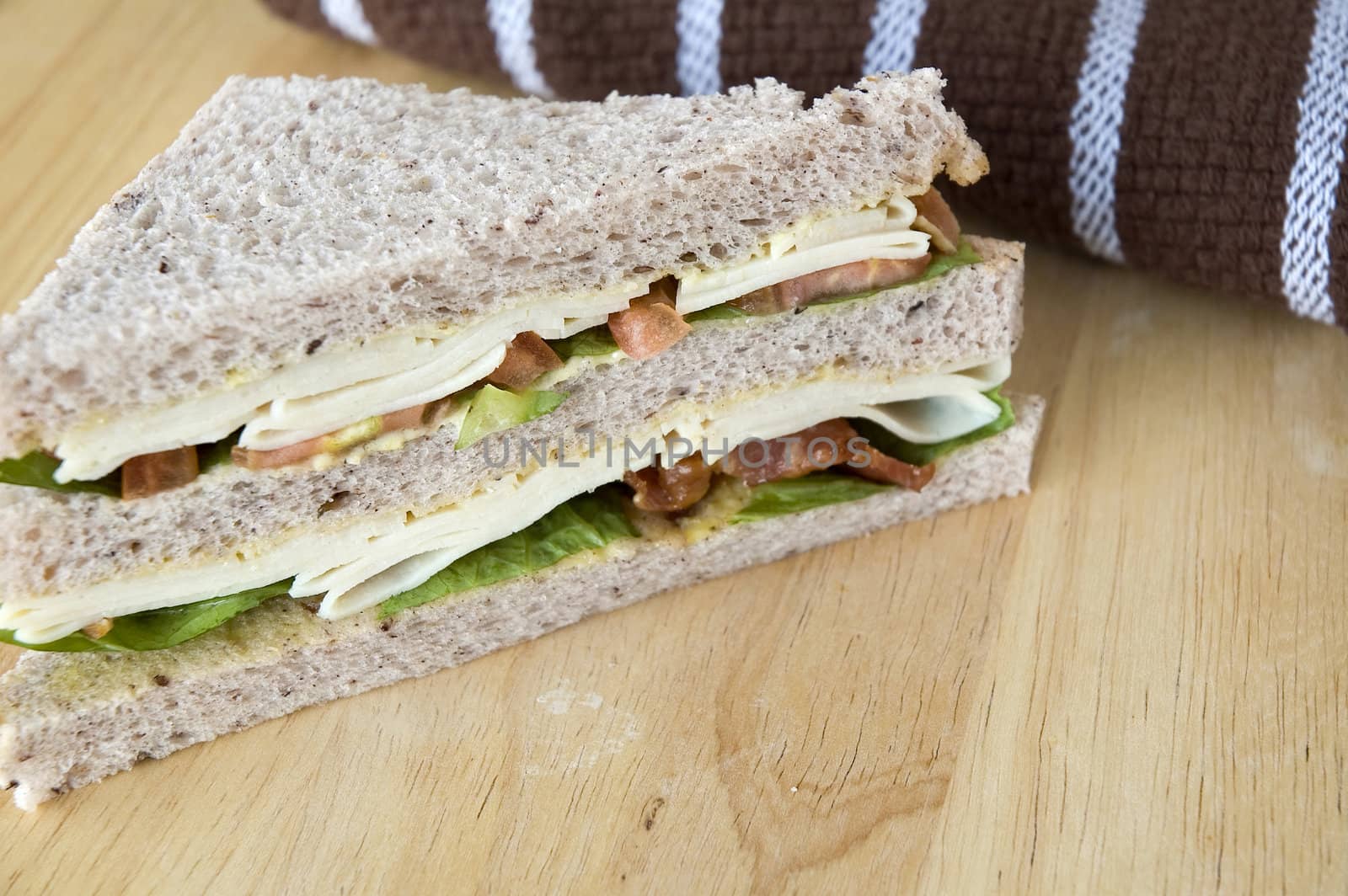 chicken and bacon sandwich on wooden table