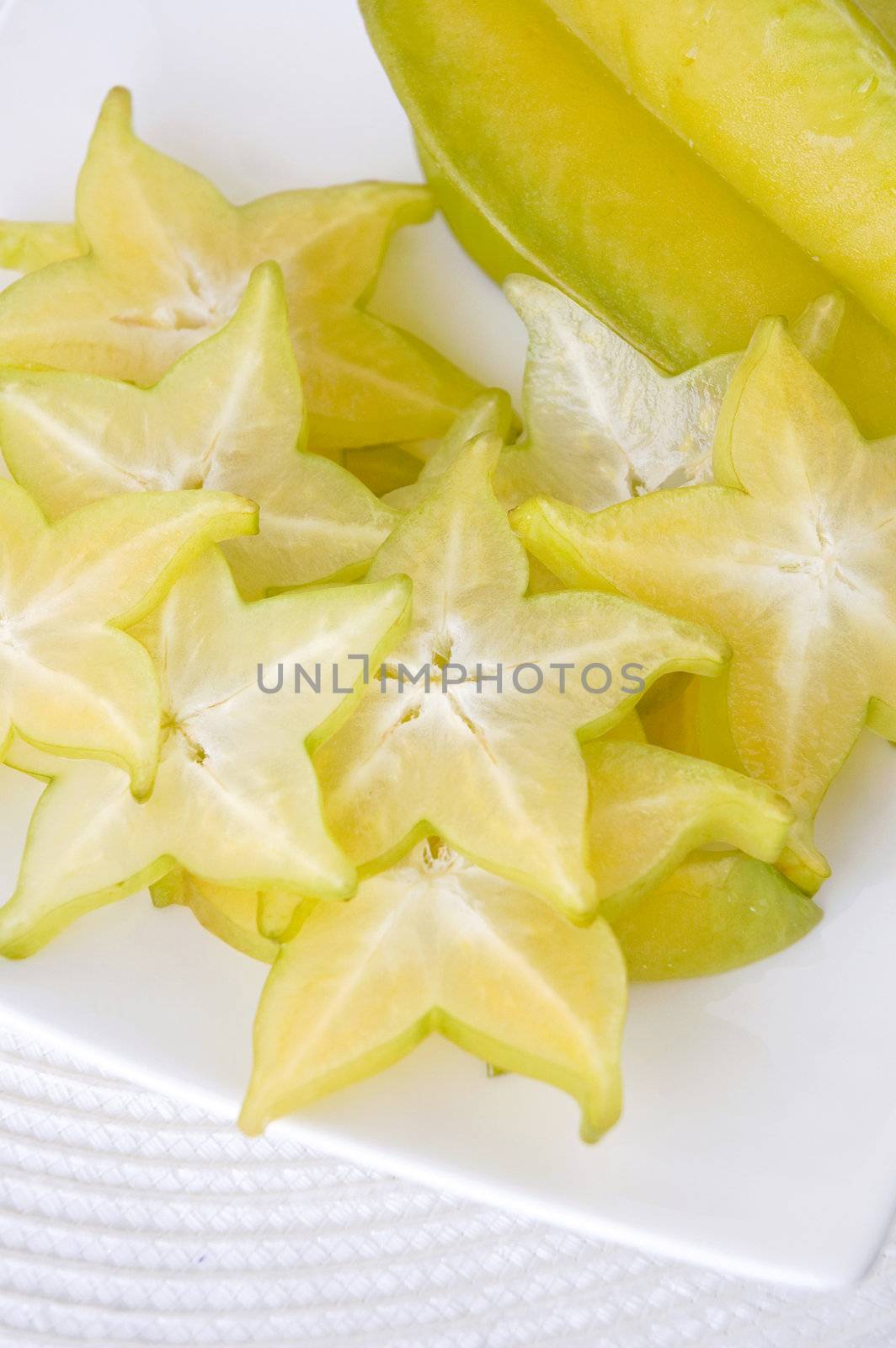 close up sliced starfruit on plate