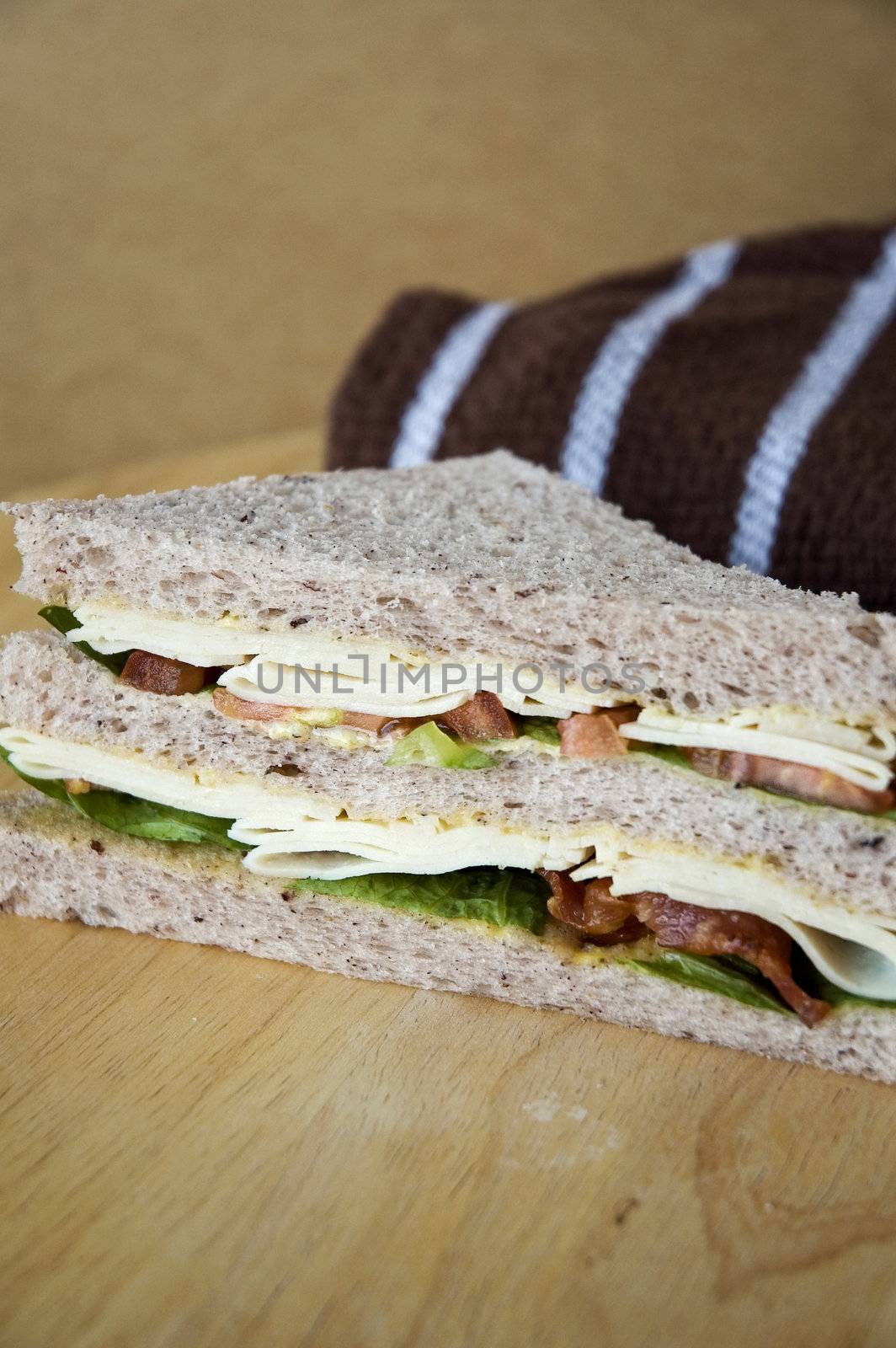healthy sandwich on wooden table by daniaphoto