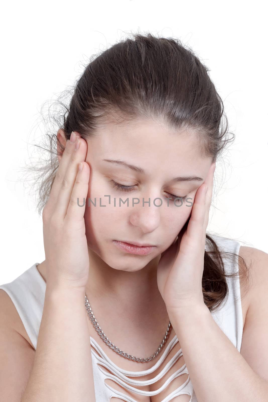 young brunette woman with splitting headache - isolated on white background