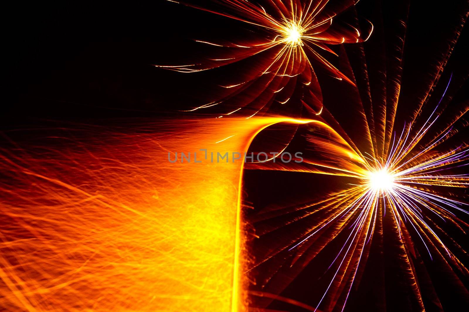 Two starbursts taking off with colorful sparkle