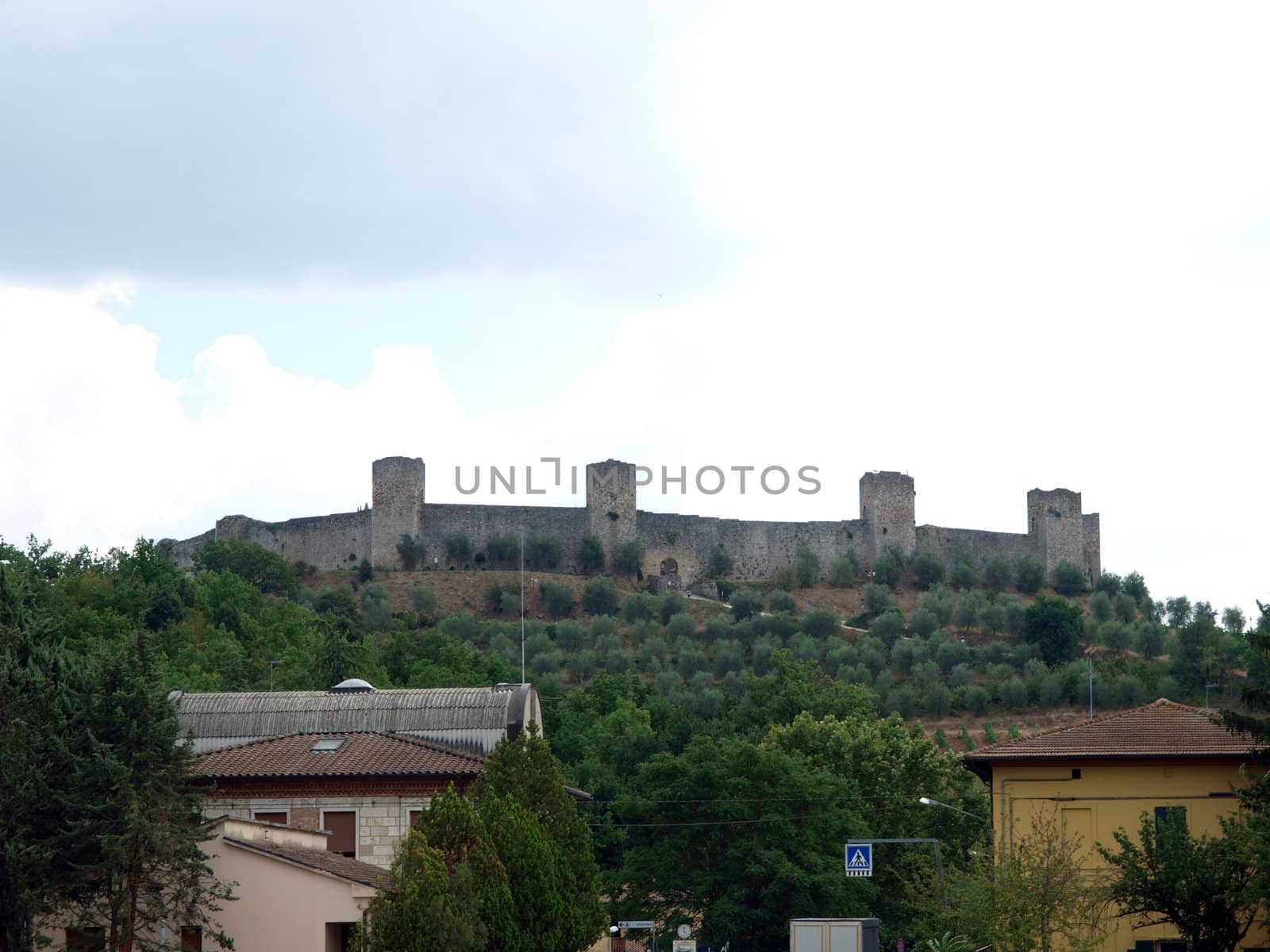 Town-walls of Monteriggioni, medieval village completely encircled from circular walls with 14 towers. Siena, Tuscany, Italy
