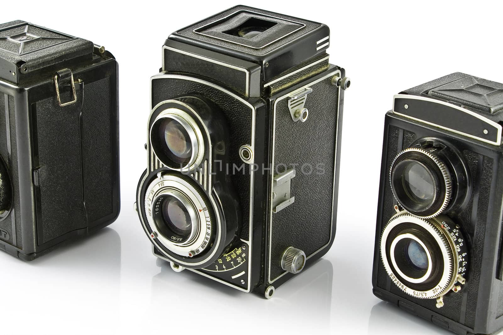 Three Vintage two lens photo camera isolated on white