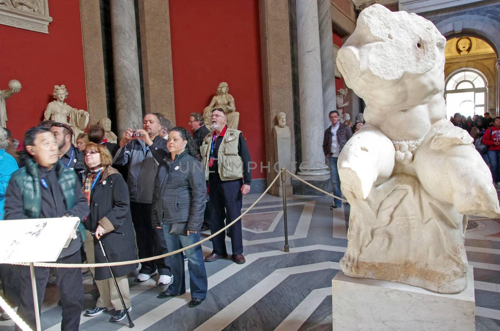 ROME, ITALY - MARCH 08: Tourists in Vatican Museum gallery, Vatican City on March 08, 2011 in Rome, Italy