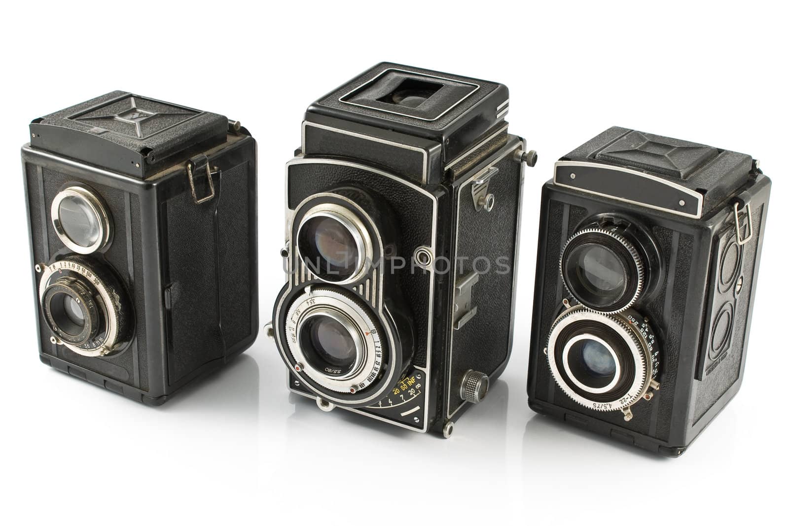 Three Vintage two lens photo camera isolated on white