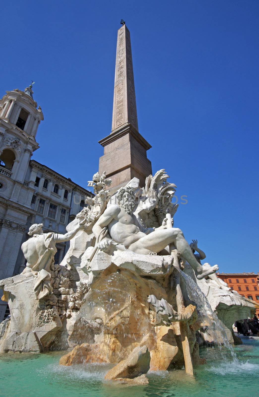 Beautiful fountain (Fontana dei Quattro Fiumi or Fountain of the Four Rivers) with an Egyptian obelisk in Piazza Navona, Rome