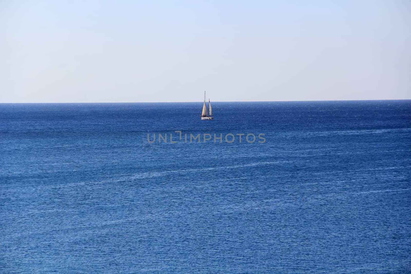 Image of calm breeze ocean and white yacht