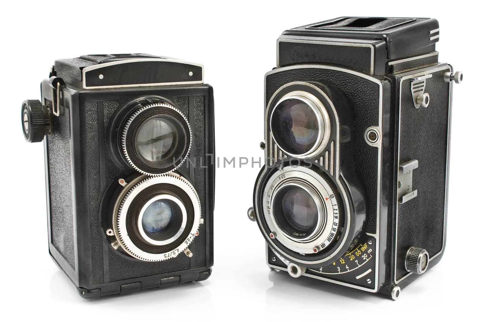 Two vintage two lens photo camera isolated on white