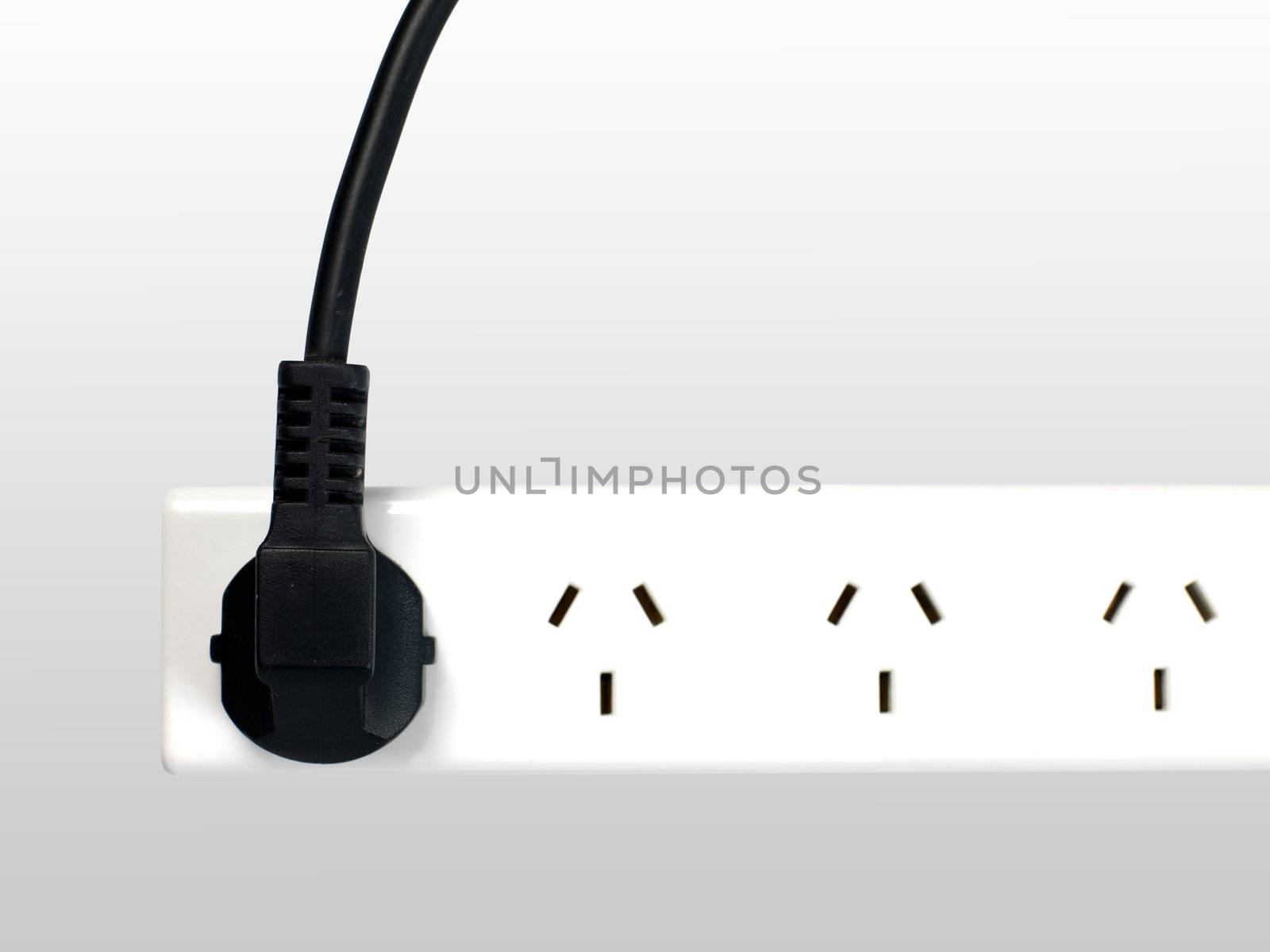 A power cord used conceptually on a white background