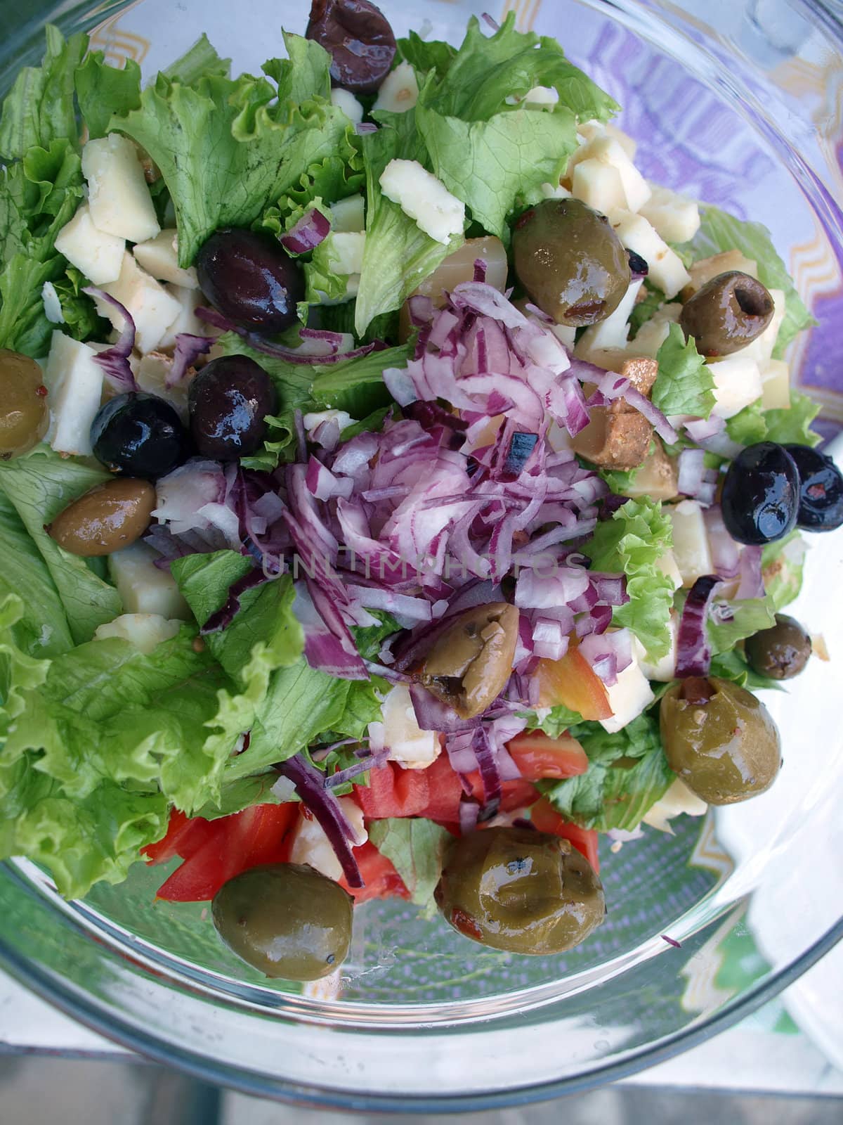 salad with lettuce, onion, black olives, green olives and tomatoes