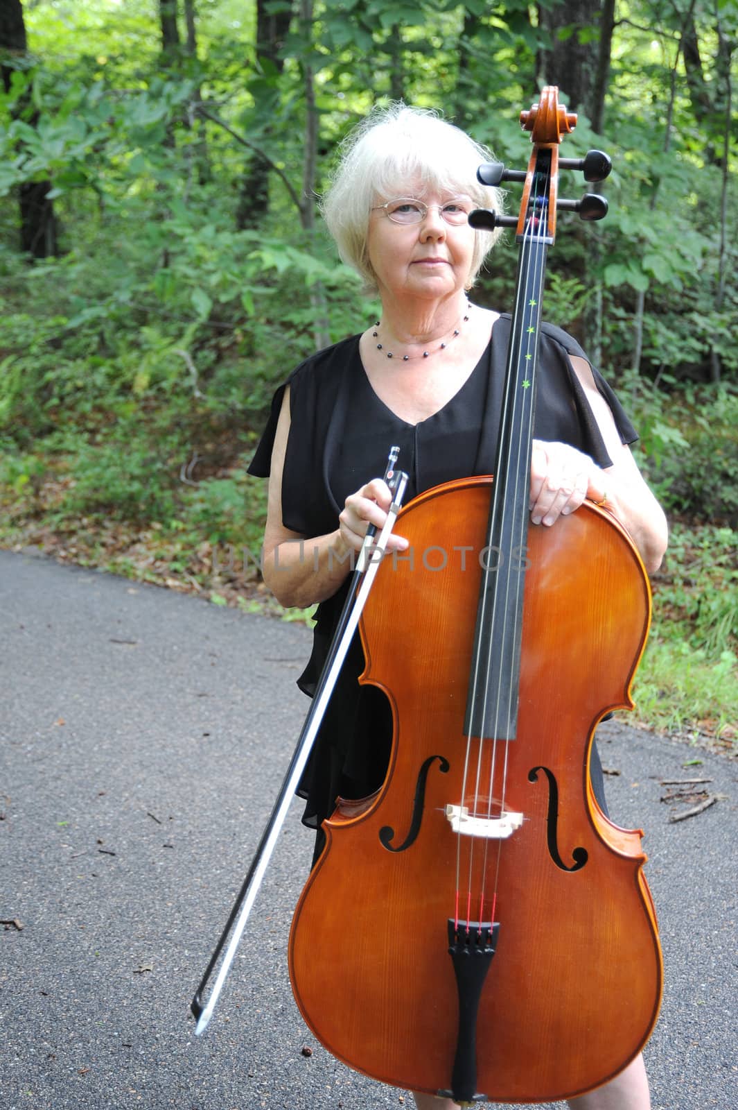 Female cellist. by oscarcwilliams